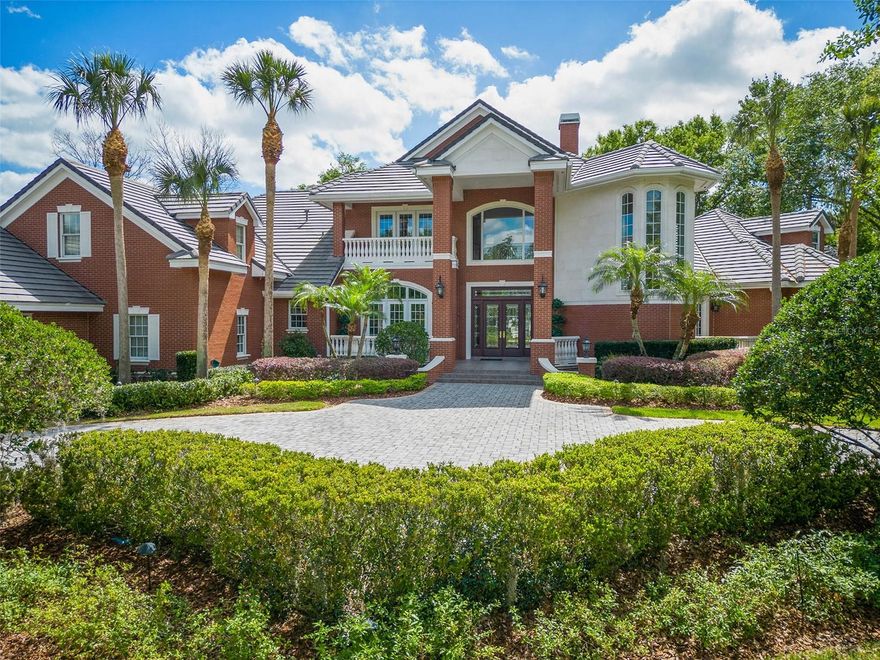 Exquisite estate home in Windermere’s private Sunset Bay community, adjacent to Lake Down and Isleworth. Custom built on nearly an acre of land, the owners of this home spared no expense when it came to designing and building. Highlights include 5 bedrooms, 6 full baths, 3 half baths, Waterford chandeliers, a home elevator, a private pool and spa with waterfall, a 5-car garage with a gated motor court, a Kohler home generator, and so much more. Offering an impressive 6,400+ sf floorplan, the interior layout includes formal living and dining rooms, two master bedrooms (each on the first floor) 3 en suite guest bedrooms, a chef’s kitchen with high-end Thermador appliances, an open family room, a 2nd floor bonus room, and two air-conditioned workshops. Throughout the home you’ll find beautiful hardwood floors, high coffered and tray ceilings, an abundance of natural light, thick crown moldings, custom built-in libraries and entertainment centers, stained glass windows, and two gas fireplaces. Enter the home through the grand 2-story foyer. Ahead you will find the living room, to the left the dining room, and to the right the home office. Down the first hall to the right are the master bedroom and the mini-master suite. At the heart of the home is the chef’s kitchen with Busby cabinetry, granite countertops and a large dinette area that overlooks the family room and screened pool and lanai. Split from the master wing you’ll find two guest bedrooms each with their own full bath, the laundry room, a full pool bath, as well as a half bath, and access to the attached 3-car garage (a second 2-car garage can be found across the motor court). Take the grand staircase upstairs where you’ll find another half bath and a large bonus room with a walkout terrace that overlooks the outdoor living space and a fifth en suite bedroom (which could be used as a home theater). Additional highlights and features include natural gas, 5 HVAC units, concrete tile roof (recently cleaned and inspected), central vacuum system,15-rifle safe, new water heater, new pool heater, two oversized 1,200 and 1,500 gallon septic tanks, and a Terminix termite bond. This home has so much to offer that there isn’t room to write about it all. Schedule your private showing today and see all the amazing features this home has to offer. Room Feature: Linen Closet In Bath (Primary Bedroom).