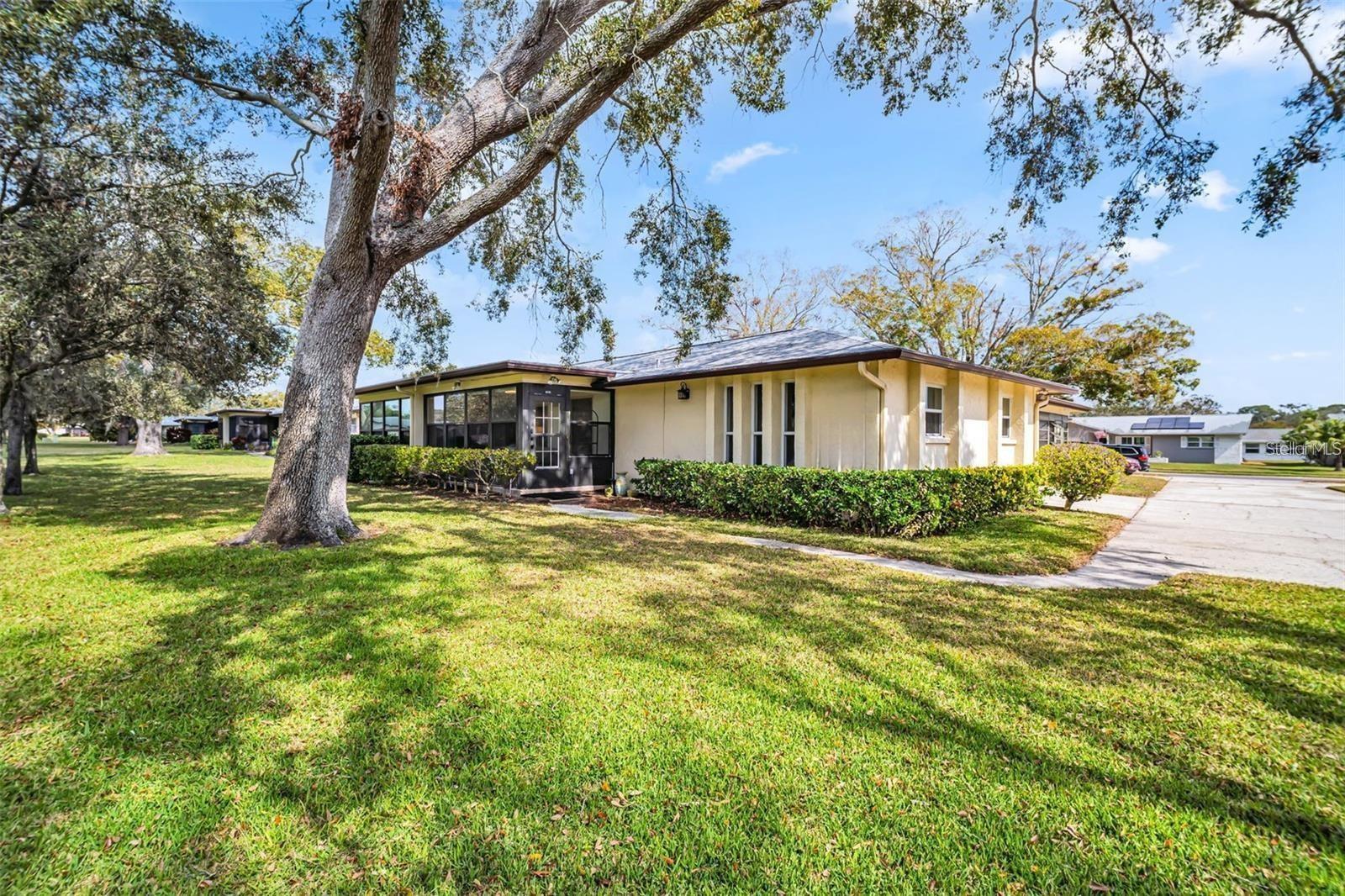 Welcome to this exquisitely renovated and remodeled end-unit villa available for rent, nestled in Palm Harbor’s highly sought-after 55+ golf community of Highland Lakes! Perfectly tucked away with no immediate rear neighbors, this villa offers a peaceful green and serene view that exudes tranquility. As you step inside, the modern, open-concept kitchen will immediately catch your eye. Featuring stunning quartz countertops, updated soft close & easy reach cabinetry, sleek stainless appliances, and convenient bar seating, this space is perfect for casual dining and entertaining guests. The expansive Florida room offers lush green views, remote blinds for convenience and adds to the living square footage to be enjoyed year-round! Both bathrooms have been beautifully updated with high quality materials, custom tile work, new vanities, and sophisticated lighting—details that are sure to impress. The entire home is bathed in neutral tones, complemented by updated fans and stylish fixtures that create a fresh and inviting atmosphere throughout. The master suite is a true retreat, offering private green & serene views, a spacious and beautifully updated en-suite bathroom, and a massive walk-in closet with custom cabinetry. The updated hall bath, conveniently located between the main living area and second bedroom, offers seamless flow and function. Safely high & dry above the flood plain, updated impact windows, updated electrical panel in 2021, remotely operable Trane HVAC 2021, and newer water heater – this villa is completely turn-key! Immediately enjoy living maintenance-free; your monthly rent INCLUDES cable TV, high-speed internet, water, sewer, trash, and lawn - essentially everything other than electricity! As a resident of Highland Lakes and also INCLUDED in the monthly rent, you’ll enjoy outstanding membership privileges that include free green fees on 3 private executive courses. The main clubhouse hosts entertainment and social events, creating a friendly country club atmosphere. Fitness, recreation, arts, interests, and hobby programs are abundant, while the Lake Tarpon Lodge offers a second heated pool, picnic facilities, a fishing pier, community pontoon boats, and free RV or boat storage. Don’t miss out on this incredible opportunity to live the resort-style lifestyle you’ve always dreamed of! Every inch of this home has been thoughtfully renovated to offer the perfect blend of comfort, style, and convenience. Come see it for yourself—you won’t want to leave!