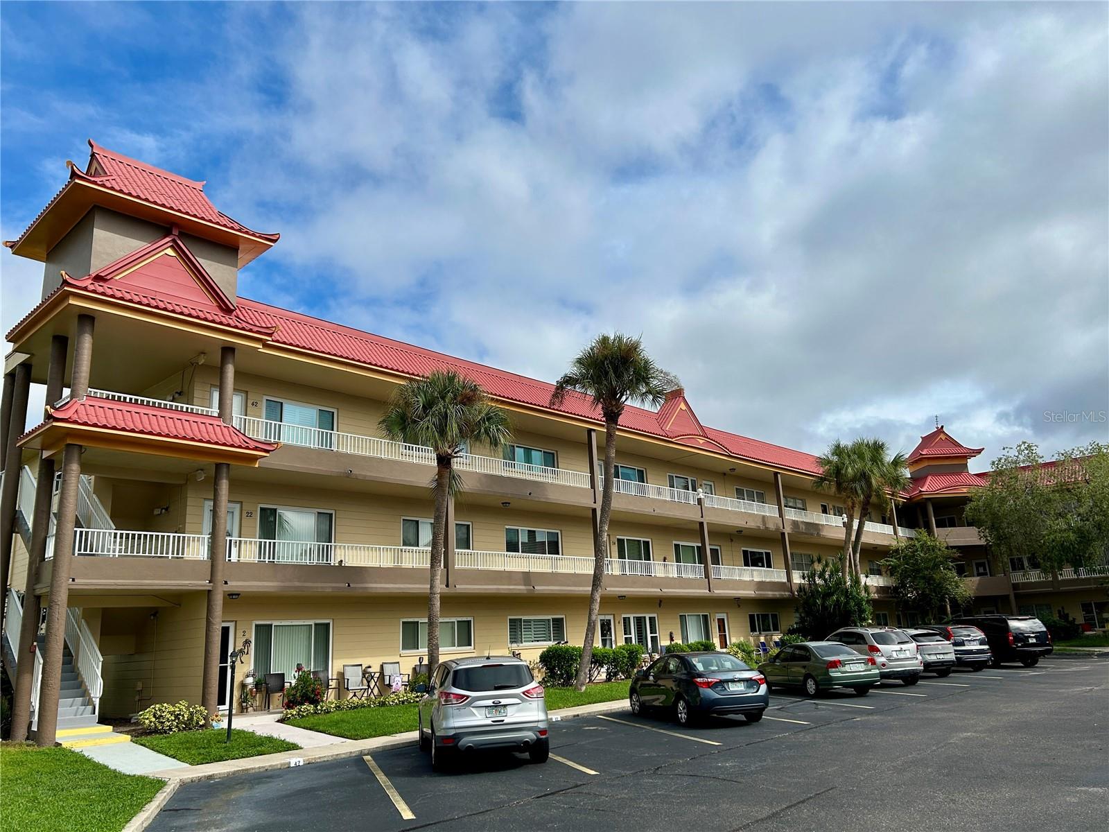 Discover the perfect blend of comfort, convenience, and community in this beautifully located 2-bedroom, 2-bath condo. Just steps from the East Activity Center, you'll have easy access to swimming pools, a state-of-the-art fitness center, tennis and pickleball courts, and so much more. Head the other way, and you'll find yourself on the golf course, ideal for both casual rounds and perfecting your swing. Inside, the condo features stylish laminate flooring throughout the living room, kitchen, and Florida room. The updated kitchen shines with stainless steel appliances, a sleek glass cooktop, and modern cabinets, counters, and backsplash. You'll also love the added convenience of your own in-unit washer and dryer. Nestled in a vibrant 55+ community, this home offers an unmatched lifestyle. Enjoy two private golf courses (9 and 18 holes), two heated pools, and two activity centers filled with opportunities to connect and stay active. From the newly remodeled cardio gym and fitness classes to dance nights, clubs, cards, and billiards, there's something for everyone. Creative spirits will appreciate the hobby studios and woodshop, while pet owners will adore the fenced dog park with shaded seating. And when you're ready for a bite, the on-site Good Karma Café makes it easy with convenient, take & bake meals and snacks. Ideally located near beaches, shopping, dining, entertainment, and transportation, this condo isn't just a home, it's a lifestyle upgrade. Schedule your showing today and experience the very best in active, carefree living! Assigned parking. All room sizes, floor plans and square footage are approximate. This property is being transferred by a leasehold estate deed. Association approval is required. If financing, a 35% down payment is required.