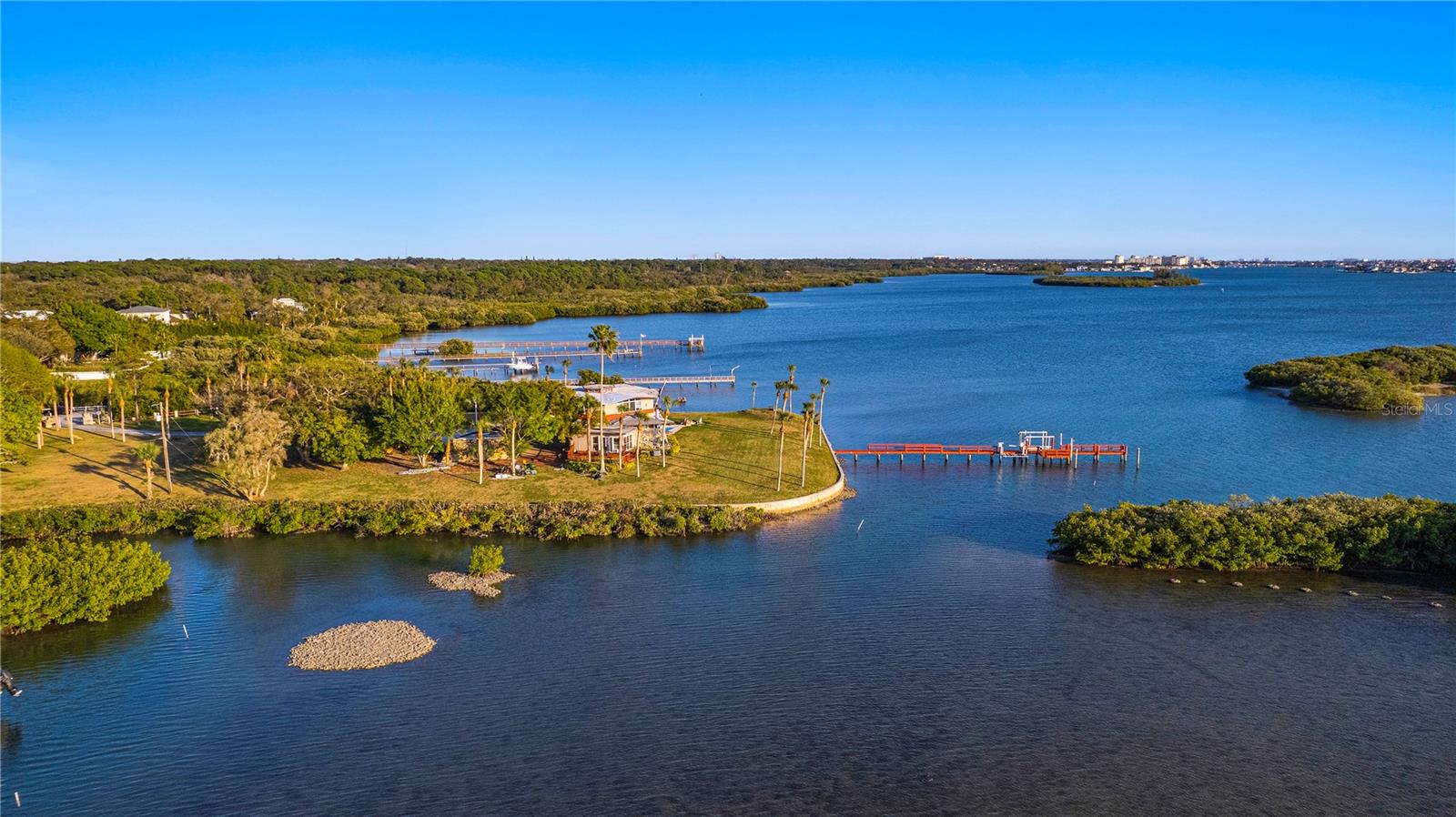 PRICE NOW REDUCED OVER $2 MILLION – BEST WATERFRONT DEAL IN PINELLAS COUNTY; 850’+++ OF WATERFRONT ... TRULY a "One of a Kind" Estate-Site VALUE.... almost 2 acres of waterfront land - DIRECTLY overlooking the Intracoastal Waterway / Boca Ciega Bay with WIDE OPEN BAY VIEWS and a beautiful sunset exposure, for nightly panoramas ... PRICE REDUCED AGAIN FOR IMMEDIATE SALE ....
With this sized parcel of land, it’s like having your own subdivision … just IMAGINE – you will not be "ON the Cul-de-Sac" here ... No, you will OWN the ENTIRE CUL de SAC / Block!! … COMPARE this asking price (of JUST $38/Sq Ft, mol) to what OTHERS ARE PAYING for a “typical” 10,000 sq ft (or less) Lot / “tear down house” in the $1-$2M range (that is $150/sq ft @ $1.5 M for a10k sq foot lot) … recent closed-sale comps in Brightwaters area have ranged from $167/sq ft to over $260/ sq foot; and btw $153-$177 sq ft on Clw Beach …. you’ll quickly “SEE the VALUE” this lot brings … PLUS None have the Privacy Factor and WIDE-OPEN VIEWS of this parcel … (You could also possibly subdivide and sell off a lot one day … call for details) … and / or potentially build another home here, one day?? …
you'll be essentially on your own PRIVATE ISLAND / PRIVATE PENINSULA … in your own “Gated Community” … with UNMATCHED PRIVACY … and LITERALLY NO NEXT DOOR NEIGHBORS on your LEFT OR your RIGHT side - JUST BAY VIEWS (and Bay Breezes) ... this is a MUST SEE opportunity for the Well-Qualified and Discriminating Buyer, who values PRIVACY, FAMILY, LEGACY, and VALUE .. not to mention VIEWS and BOATING! … you’ll also get the ability to have an ADU in addition to your Main Home … AND the ability to use this as an Airbnb-type of vacation rental (subject to Pinellas County's regulations) should you so desire ...
Watch your Kids (or Grand Kids?) play FROM THEIR OWN FAMILY HOME, knowing they are Safe @ Home ... LARGE DOCK with boat and double jet ski lifts …great for fishing and easy Intra-Coastal access for all of you Jet Skiers and boaters! … 180+ degree WATER VIEWS to the North and South - as well as Westerly, are sure to not only “please’, but to ENCHANT you and your Family & Guests all day and night! … …
This LOCATION is in a GREAT, Centrally Located part of Mid- Pinellas County, Tampa Bay – it’s about a 7-minute drive to The Beach and close to Seminole High School, and lots of shopping, restaurants and etc ... it's maybe a 40-minute drive to Tampa International Airport ... This is a great option for a 1031-type Buyer as well ... SELLER will consider a Lease-Option with substantial down payment and will review an offer involving a split of property, THOUGH that is not a preference… Be SURE and watch the Drone Virtual Tour VIDEO as well as view ALL of the photos .. HURRY on this one!