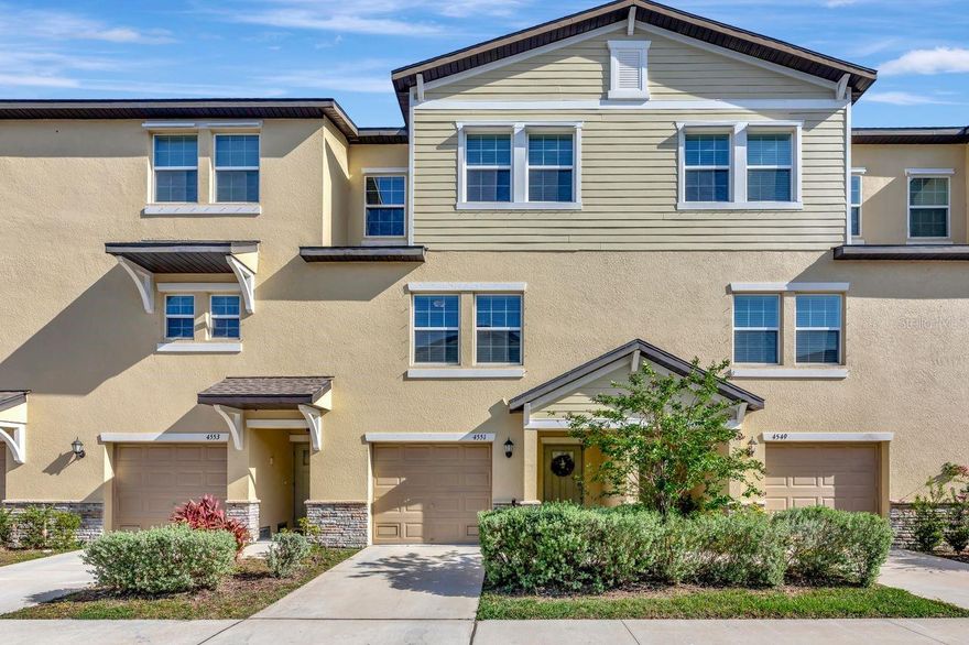 Welcome home to the gated community of Palm River! Located just 10 minutes from Downtown Tampa, and built in 2023, this three story townhouse is sure to check all of the boxes. On the ground floor, you will find your massive 2+ car garage along with ample storage space, which is hard to come by in a townhouse. As you walk upstairs to the second floor, you are welcomed with a large open floor plan consisting of the kitchen and living room area, along with a secondary bedroom and full bathroom. Just off the living room, a large porch overlooks the pond in the backyard where you can enjoy your morning coffee or take in a nice sunset to wind down from a long day. On the top floor, you will find the primary bedroom which also overlooks the pond, and is equipped with a large walk-in closet, as well as the en-suite primary bathroom which features dual sinks, and a walk in shower. Just down the hall, you will find the other two secondary bedrooms which are perfect for guests, or a home office. The HOA fee covers water, sewer, trash, cable, internet, and more. Also included in your fee, and just a short walk away from the unit, is the community pool. At the front of the community, you will find a large dock equipped with an area to launch your kayak and enjoy the beautiful city view on the Tampa Bay waters, right from your own neighborhood. Schedule your tour to view this beautiful, move-in ready home today!