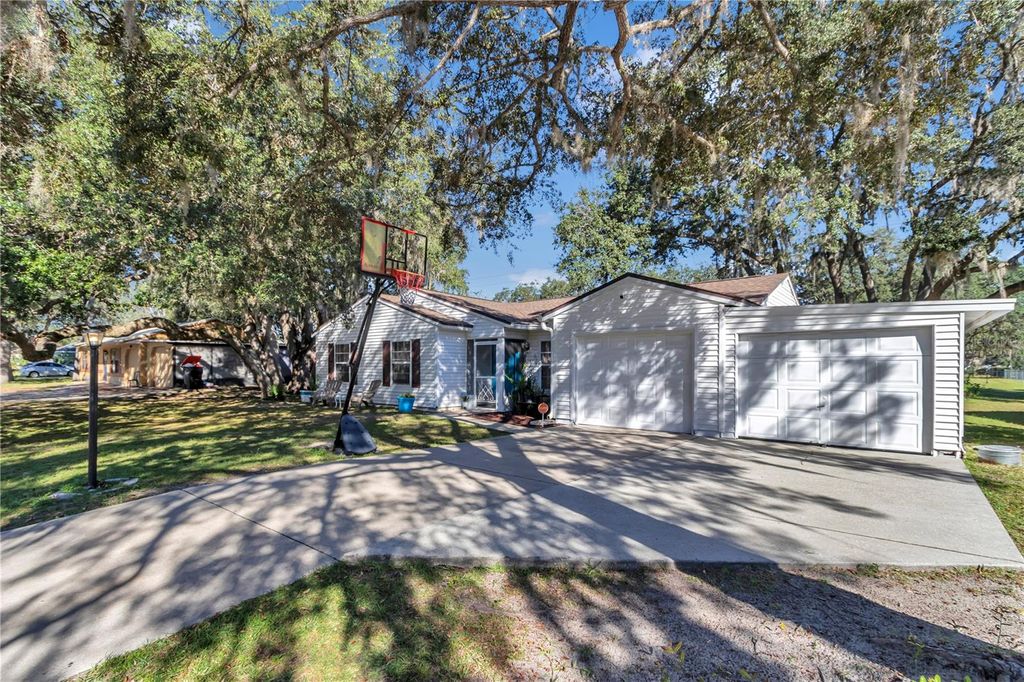 Photo of 303 Oak Track Pass, Ocala, FL 34472 (MLS # OM710637)