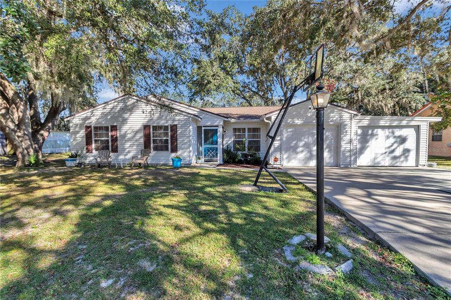 Lovely 3 bedroom 2 bath home with a 1 car garage on a .38 acre lot. To the right of the garage there is an 11 x 20 attached storage room that could possibly fit a small car. New Roof in 2019. Open floor plan. Spacious living room and a generously sized dining area. A separate Florida room overlooks the large rear yard. New wood vinyl plank floors throughout, except for the baths. The beautiful kitchen was remodeled in 2020, the countertops are granite and there is room for a small table and chairs. The HVAC was replaced in 2013. The $145/year HOA fee includes weekly trash and yard trash pick up. As an owner in this community, you have access to a private park and 2 lakes. The stocked lake allows for fishing (catch and release). This home is located just minutes from Walmart, Publix, Aldi, Winn-Dixie, Walgreens, Dollar stores, eateries, post office, parks, churches, etc. Easy access to major roads. For a low fee you can also purchase a membership to the Silver Springs Shores Community Center, which includes basketball courts, pickleball courts, a pool, and tennis courts. Activities at the community center and youth center include karaoke, water aerobics and game nights. Conveniently located near schools and is only a short walk to Lake Weir High School.