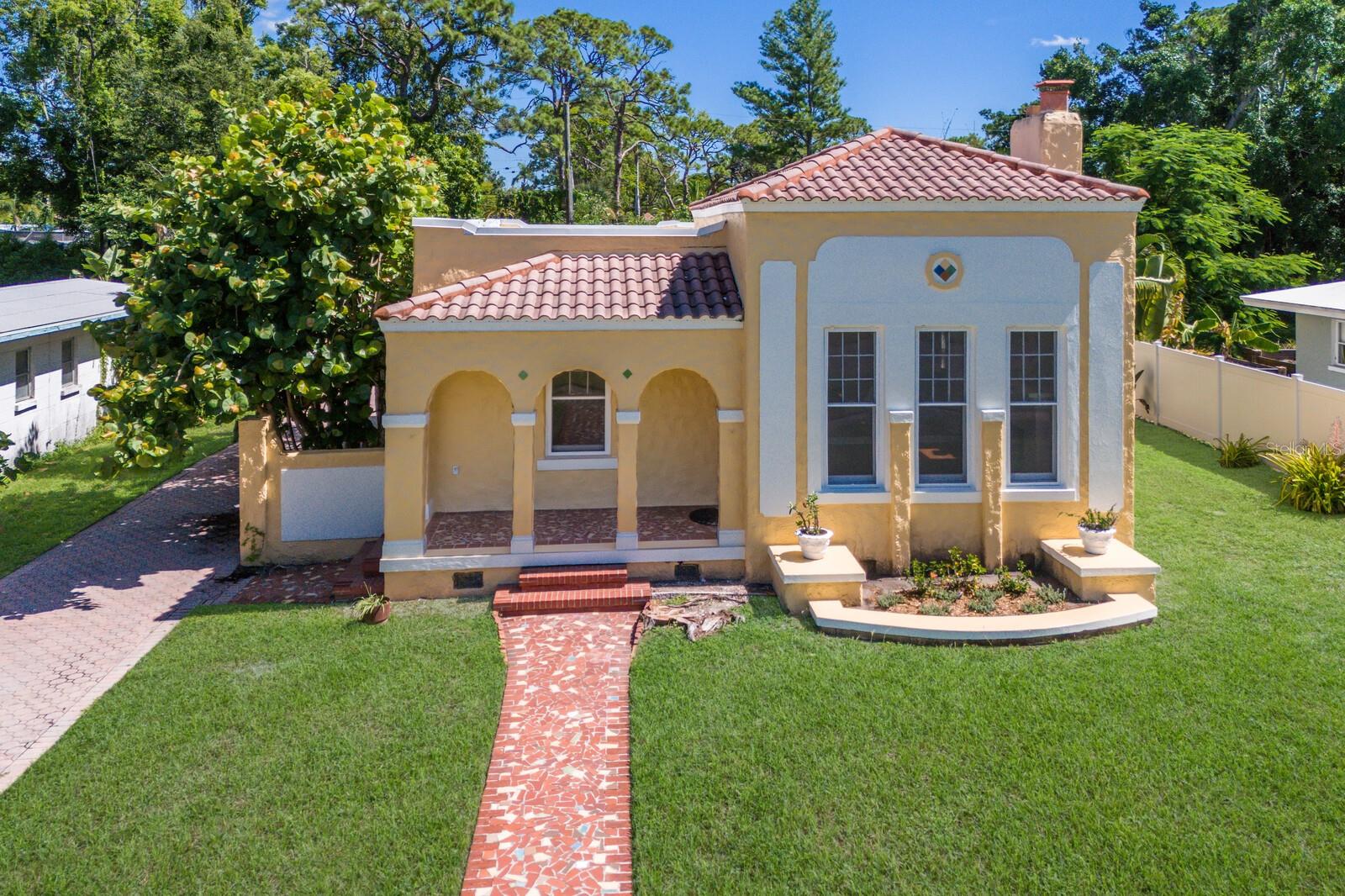 Step into timeless elegance with this stunning 3-bedroom, 2-bath Spanish Eclectic bungalow nestled in the heart of sought after Sapphire Shores. Rich in character and historic detail, this residence showcases dramatic architectural elements including beamed and coffered ceilings, gleaming oak floors throughout, and expansive windows that bathe every room in natural light. The spacious “sunken” living room centers around a show-stopping, decoratively carved mantelpiece, perfectly blending artistry with old-world charm. Each space offers a unique sense of craftmanship, from graceful arches to finely detailed trim, evoking romance and warmth of classic Mediterranean design.
The current owner has elevated this home with a seamless addition: a stunning primary suite with a vaulted ceiling, French doors leading to a private back yard and a walk-in closet. Other “modern” updates include a spacious kitchen with and island and adjacent dinette, interior laundry and a 2-car garage accessed by a covered walkway; a loggia in keeping with the traditional nature of this architecture.
Located just steps away from Sun Circle Park, Sarasota Bay, the Ringling Museum and the vibrant arts scene, this home is ideal for those seeking history, charm and convenience in one of Sarasota’s most beloved neighborhoods. Sapphire Shores in an eclectic waterfront neighborhood dating back to the Ringling Era and is now a combination of historic Mediterranean mansions, classic ranches and new construction. Live here amidst Sarasota's most significant cultural & educational institutions and you're only 2 miles north of downtown Sarasota, a 12-minute drive to St. Armands Circle and the beaches of Lido and Longboat Key and an equal distance to University Parkway anchored on the west by SRQ International Airport and UTC Mall and I75 on the east.