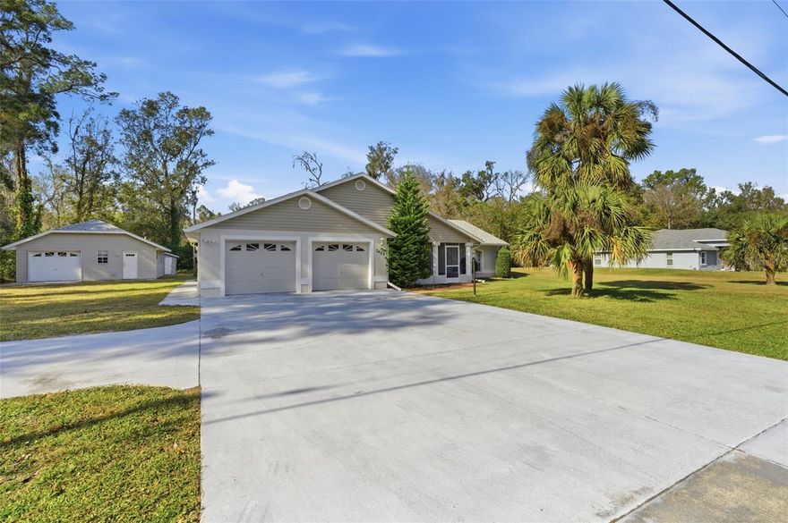Beautiful Move-In Ready Home on ½ Acre Lot. Welcome to this stunning 3-bedroom, 2.5-bath home that's truly move-in ready and packed with upgrades for your peace of mind. Key Updates: New Roof (2022) with quality dimensional shingles on both the home and detached garage. New A/C (2018), Fresh Interior Paint, New Water Heater to be installed December 2025. Enjoy your morning coffee in the 20x10 screened front porch with quality ceramic tile flooring. Step inside and feel instantly at home with a spacious open floor plan, cathedral ceilings, and abundant natural light (one living room photo was virtually staged). The large kitchen is a chef's delight, featuring: Stainless steel appliances (only 2.5 years old), ample cabinetry for storage, expansive countertops and a breakfast bar for easy meal prep. The dining area flows seamlessly from the kitchen and opens through French doors to a 36x16 screened back porch, fully tiled and connected by a walkway to the detached garage. The primary suite includes a walk-in shower and large walk-in closet. The indoor laundry room offers a dryer, laundry tub, and convenient half bath. Additional features include: Attached 2-car garage with pull-down attic stairs, extra storage cabinet with sink & a side service door. Detached 1-car garage with a workshop for tools, equipment, and hobbies ~ Spectrum high-speed internet, County water service & an irrigation well too! Enjoy the peaceful feel of country living while being just minutes from downtown Brooksville, with shopping, restaurants, hospitals, and medical facilities nearby. Don't wait—schedule your appointment today to see this beautiful home. You won't be disappointed!