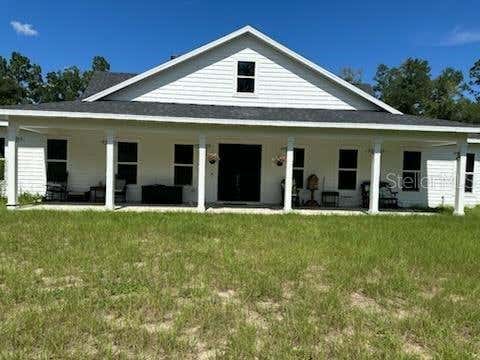 Photo of 5040 NE 48th Court, High Springs, FL 32643 (MLS # TB8532522)