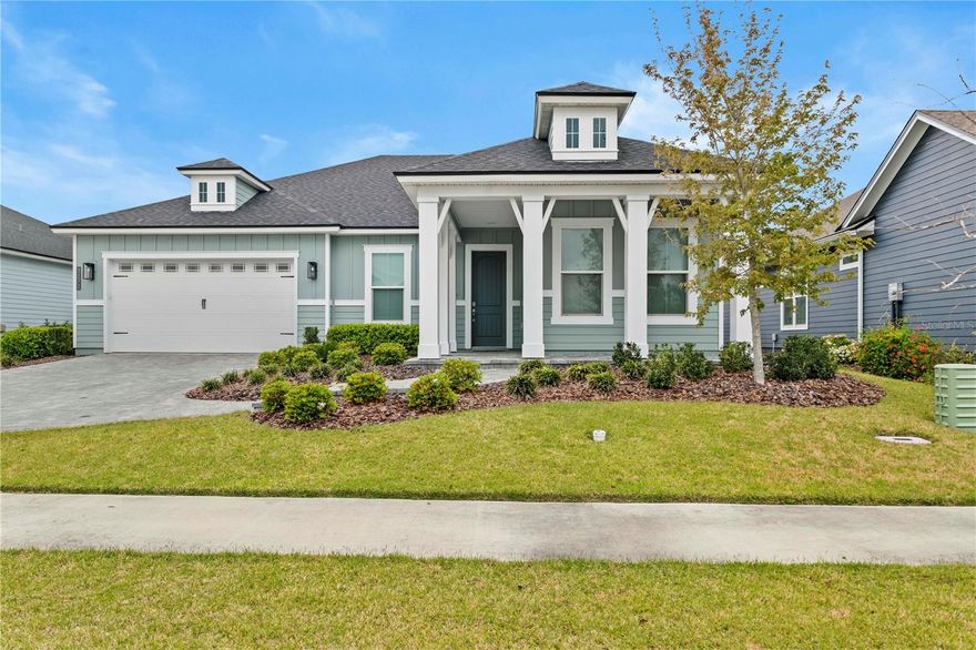 Looking for a beautiful, newly built 2022 home? Welcome to the highly sought after community of Oakmont! This open floor plan home has 3 bedrooms, 2 full baths, and a flex room with pocket doors for privacy. The bedrooms and flex room are carpeted, with tile flooring in the rest of the home. Delight in easy to care for countertops with a spacious kitchen island. Lots of cabinets and a corner pantry. Appliances include refrigerator, dishwasher, gas stove, microwave, disposal and washer and dryer (not warranted). Upgrades include soft close cabinetry, upgraded flooring throughout, cambria quartz countertops, security system installed, cellular shades, and ceiling fans. Enjoy the gorgeous curb appeal with brick pavers for the driveway, walkway and front covered porch. Step outside the back sliding doors into the extended covered lanai with pavers and a fenced back yard. Irrigation and a drip line system has been installed. Additional landscaping with fast growing privacy bushes on both sides of the rear property have been added. Oakmont offers community lifestyle events and programs as well as access to the pool, gym, tennis courts and more. This home is situated on the western edge of Gainesville with easy access to everything North Central Florida has to give from nature trails and waterways, to shopping, to the University of Florida campus & UF Health.