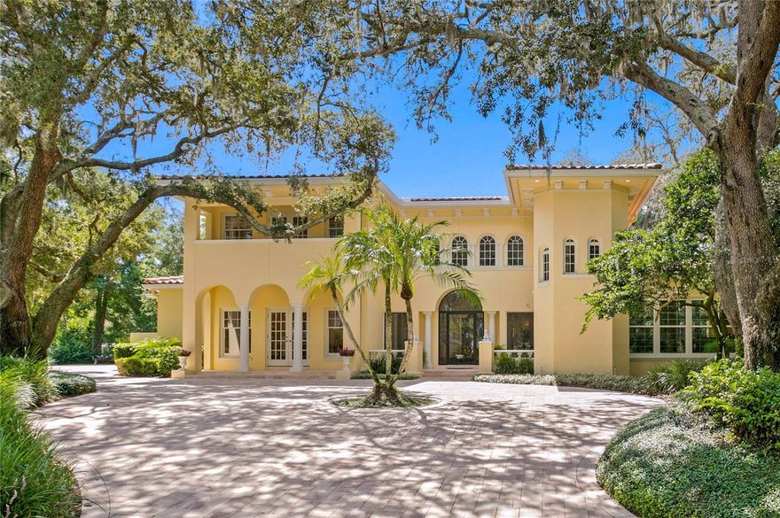 Welcome to this timeless Mediterranean beauty in Avila Golf and Country Club, the most prestigious guard-gated community in Tampa Bay. This extraordinary residence offers a secluded and private environment at the end of a cul-de-sac. Stepping into the double-height foyer, natural light cascades in, warmly welcoming guests. Recent updates include four newly renovated designer baths, custom closets in the main suite, new water heaters, seamless aluminum gutters, exterior LED lighting, a new paver driveway, a fresh coat of interior and exterior paint, and impact glass windows in the main suite, formal living room, office, and pool bath. The detached in-law suite features a full kitchenette. The outdoor kitchen, overlooking the pool and yard, is ideal for entertaining friends and family. The family room boasts a double-height ceiling, while the kitchen, featuring a 6-by-9-foot island, is perfect for the family chef. The main suite is located downstairs. This property offers the invaluable gifts of privacy and security, ensuring your peace of mind within this exclusive community. Centrally located, it's just a brief 25-minute drive from downtown and Tampa International Airport, simplifying your travel needs. A short 45-minute drive will take you to the coastal havens of Clearwater and St. Pete, promising diverse experiences within reach.