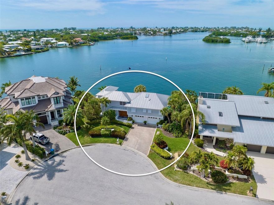 Spectacular WATERFRONT RETREAT AND Phenomenal BREATHTAKING VIEWS, views and more views of Bimini Bay on Anna Maria Island will capture your heart as you enter this meticulously maintained North Pointe home within Key Royale neighborhood!  Enjoy sunset views on your deck or sit on the dock or seawall to fish, watch dolphins, manatees and other marine life.  This boater’s paradise comes with a 60 foot dock, 116 foot concrete seawall and 10,000 lb boat lift.  Magnificent views of the water and waterfront decks from almost every room! Nestled in a quiet Cul de sac this home boasts an open concept of living space with french doors to a large deck and massive views of Bimini Bay.  There is plenty of space for you and your guests as this home boasts 4 bedrooms PLUS den, 3 1/2 baths, heated pool, new decks, and a large two car garage.  As a member of the North Point Harbour association you have access to a community pool, tennis and pickleball courts.  Key Royale Club, located just three blocks away, offers a nine hole course with golf and social memberships.  The famous sandy beaches of Anna Maria await you as does historic Pine Avenue, quaint restaurants and shopping, Bean Point, and the City Pier.