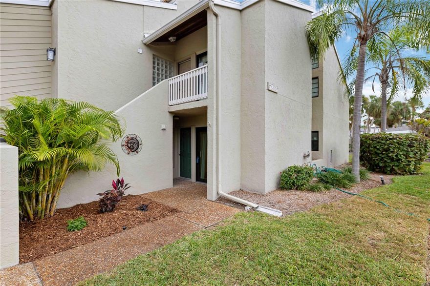 Welcome to your tropical retreat on Longboat Key! This newly renovated 2-bedroom, 2-bath ground-floor larger end unit, with additional windows blends light coastal charm with modern comfort in a sought-after Gulf-to-Bay community. Thoughtful upgrades include neutral tile flooring throughout (no carpet), crown molding, upgraded baseboards, fresh interior paint, impact-rated PGT windows and sliders, and in-unit laundry with full-size machines. A private exterior storage room and peaceful garden-view patio complete the picture.

The bright, open kitchen features granite countertops, solid wood cabinetry, new stainless-steel appliances, and a breakfast bar that flows seamlessly into the living and dining areas—ideal for both entertaining and everyday living. The spacious primary suite offers a large closet & updated ensuite bath. Need extra space for an additional guest bedroom or office? As a bonus, the master also has a sliding panel that when closed creates a spare room with its own private barn door entrance. A split-bedroom floor plan ensures privacy, with the guest suite tucked behind a frosted glass door and featuring its own bath and linen closet.

Located on the bayside of this intimate Gulf-to-Bay community, you will enjoy deeded beach access, a clubhouse, fitness center, heated pool, kayak launch, fishing pier, and tennis/pickleball courts. Spend your mornings kayaking Sarasota Bay and your evenings enjoying sunsets on the private Gulf beach—complete with complimentary beach chairs.

Banyan Bay is a friendly, boutique community of just 44 residences, offering covered parking and a rare pet-friendly policy with no size or breed restrictions. The community has passed its milestone inspection and is certified for another 10 years, providing added peace of mind. Rental-friendly (up to 4 leases per year, 1-month minimum), this property is ideal as a full-time residence, vacation getaway, or income-producing investment.
Conveniently located near shops, dining, parks, Anna Maria Island, St. Armands Circle, and downtown Sarasota.
Offered turnkey furnished—this is truly the best of Gulf-to-Bay living.