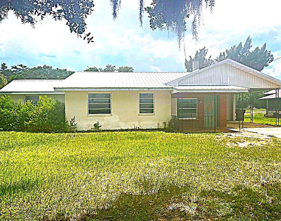 Close to River Ranch on Hwy 630 E, this 3 Bedroom 1 1/2 bath block home has new Kitchen cabinets with soft close drawers, new counters, new Frigidaire refrigerator and microwave and new flooring. Frigidaire stove and double sink top off this very nice kitchen. Adjoining the kitchen is large dinette area and access to the back screened porch, fenced back yard and laundry room. When entering the home you instantly notice the tongue and groove ceilings in the family room and living room. The family room has a brick fireplace and French doors leading in the the dinette and kitchen. Off of the family room is a storage room that could easily be a walk in pantry. The oversized living room is the center of the home and leads to the 3 bedrooms. The master has a half bath with pedestal sink and toilet. The 2nd and 3rd bedrooms are close to the full bath with newly refinished tub shower combo. Fenced back yard, Newer metal roof, New AC, storage, covered front entrance, 1 car carport and additional parking make this home complete. Arriving at the home you will notice oak trees, azaleas and palm trees. Restaurants, grocery store, parks and other businesses are just a short distance away. Located not far from River Ranch, LegoLand and other attractions and in the center of the state so easy access to Tampa and Orlando airports, Disney and beaches on either coast. Come take a look and make this your forever home.