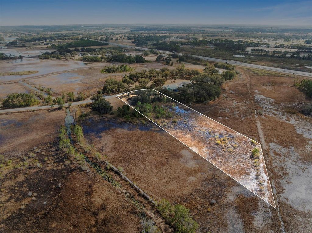 Photo of 446 Long And Winding Road, Howey In The Hills, FL 34737 (MLS # O6386207)