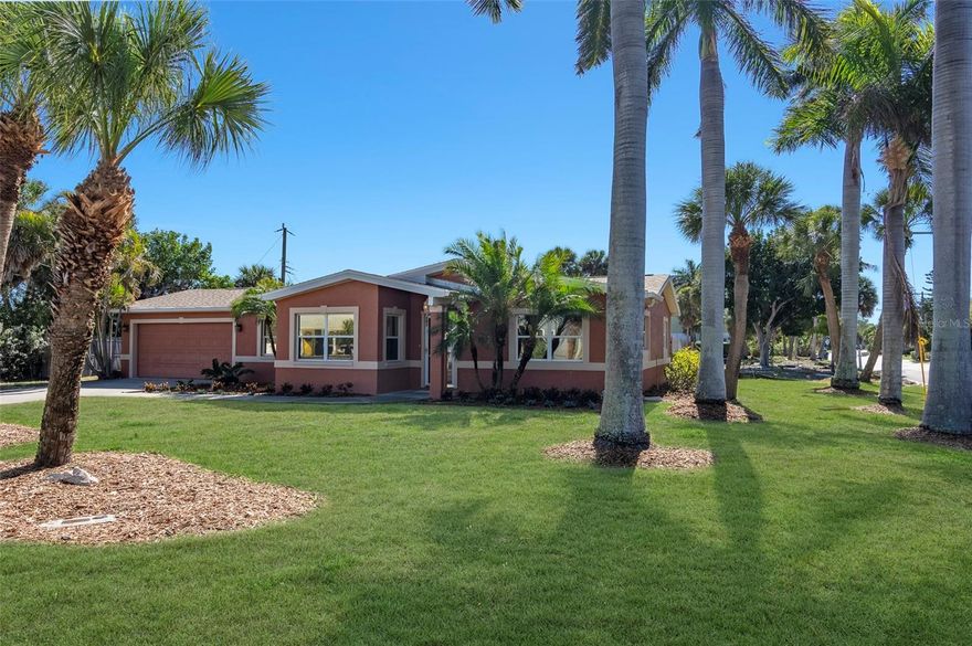 Island living at its finest in beautiful Belle Vista, one of St. Pete Beach's most beloved neighborhoods. This coastal retreat is perfectly positioned just across the street from McPherson Bayou and 4 blocks from Belle Vista's deeded access to world-class beaches. Majestic Royal Palms cradle this corner lot and welcome you home to this meticulously renovated coastal oasis. Natural light flows through this open, contemporary split floorplan, offering a seamless transition from the living/dining/kitchen, as well as a cozy sunroom. Be the first to unwrap all new stainless steel kitchen appliances/cabinetry, and enjoy the ease of entertaining or gathering with family & friends in this open-concept plan. Exterior features include a covered patio and an outdoor shower. The professional top-to-bottom restoration of this solid block construction home includes all new plumbing and electrical systems. This property is turn-key & ready for you to enjoy beach strolls or shopping & dining at many restaurants on Corey Ave, the iconic Don Cesar Resort, and historic Pass-a-Grille. The community of Belle Vista offers many amenities: beach access & parking, parks, playgrounds, and even a floating dock for your paddleboard/kayak. Just a short drive over the Bayway bridge takes you to downtown St. Pete, and Tampa International Airport  just 30 minutes away. Hurry and schedule your private showing today; this exceptional value will not linger!