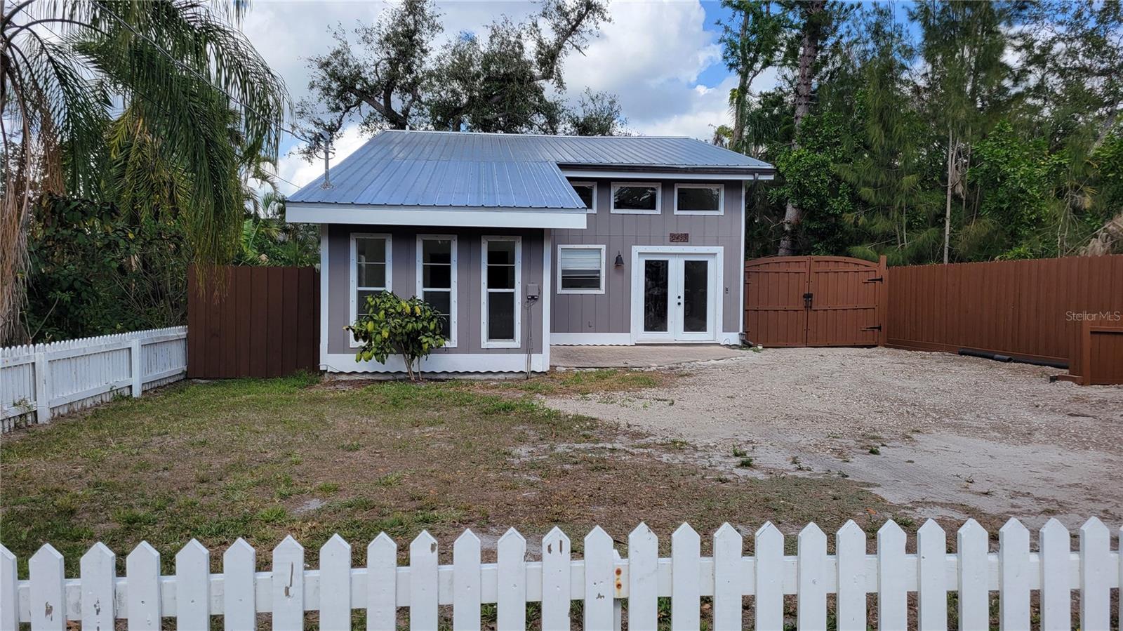 Annual UNfurnished Wonderfully renovated 3/2 home on quiet street. This home has amazing natural light from cathedral ceilings with clerestory windows and the open floor plan. There are some very special features that make this home special and very attractive: the cathedral ceilings, the kitchen with solid wood cabinets topped with slab granite counters, stainless steel appliances and pass thru window to the dining area. There is also a spiral staircase that leads to the master suite on the 2nd floor which is spacious and has an adjoining room for an office or den. There is also a large walk in closet with organizer and master en-suite bathroom. The other 2 bedrooms are on the ground floor. NO CARPETING-all tile or wood flooring. This home is on a maintained well and septic so no water bill! This place is something special so CALL today!