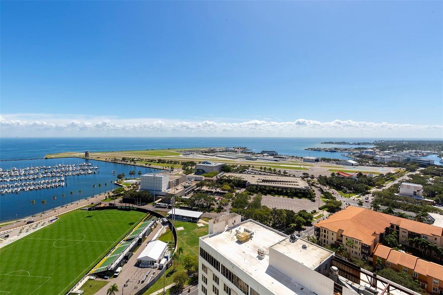 Welcome home to a life of grandeur and unparalleled elegance in the heart of Downtown St. Petersburg at Saltaire. This newly constructed 2-bedroom, 3-bathroom with a den condominium is set in the heart of downtown and offers a lifestyle of unparalleled magnificence, providing you with expansive views that encompass iconic landmarks of the city. As you step inside, you'll be captivated by the breathtaking southern vistas that stretch far and wide, featuring historic Al Lang Stadium, the picturesque St. Petersburg marina basin, the glistening waters of Tampa Bay, the Mahaffey Theatre, and the renowned Dali Museum. This condominium is a testament to opulence, boasting a plethora of luxurious finishes throughout. The kitchen and bathrooms are adorned with contemporary European-style cabinetry, quartz countertops, and superior appliances. The well-appointed bedrooms come complete with en-suite bathrooms and balconies, inviting ample natural light and comfort. The owner's suite boasts an exquisite bath with a soaking tub, frameless Euro Shower doors, frosted glass water closet, and two spacious closets. Two large terraces grace this residence, allowing you to savor both the sunrise and sunset, the excitement of a Rowdies game, the spectacle of planes arriving and departing from the Albert Whitted Airport, and the beautifully lit Sunshine Skyway. Moreover, this location offers one of the finest vantage points in downtown to witness the annual St. Pete Grand Prix.  Convenience is paramount, with a flexible den or media room just inside the entrance to the unit as well as two parking spots and a storage unit at your disposal. Saltaire offers an impressive array of amenities, ensuring a life of unparalleled ease. Optional valet parking, a dedicated front desk staff, and on-site property management are at your service. Residents can indulge in the expansive pool deck, outdoor kitchen area, and cabanas with stunning views of the waterfront, downtown Tampa, and the bay. Stay in shape at the well-equipped fitness area and workout studio, unwind in the news café, spend quality time with your furry companion at the 7th-floor dog park, and entertain guests in the stylish club room. Saltaire elevates your expectations of luxury living and places you within walking distance of St. Petersburg's vibrant urban core. You can savor the city's offerings with waterfront views just a few blocks away from the hustle and bustle of Central Avenue. This is your chance to experience the pinnacle of new construction luxury living in Downtown St. Petersburg. Don't let this opportunity pass you by. Schedule your exclusive private tour today and embark on a journey into the lap of luxury living at Saltaire.