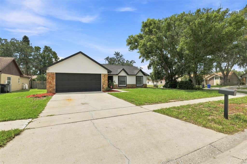 Photo of 1607 Oak Arbor Lane, Valrico, FL 33596 (MLS # TB8542573)