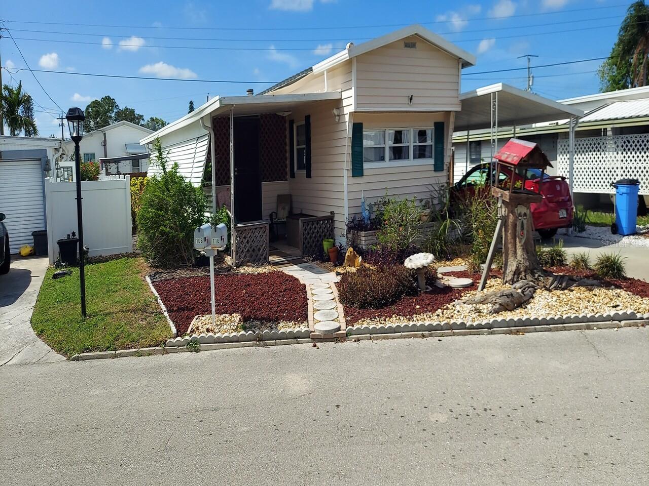 LAND OWNED $145,000.00 FEES ONLY $140. /MO INCLUDES WATER, SEWER, TRASH LARGE ROOMS HIGH CEILINGS 2 BR 1 BATH 900 SQ FT NEWLEY REMODELED KITCHEN, WASHER & DRYER UPDATED HVAC SYSTEM, ELECT SERVICE, WATER HEATER & PLUMBING FENCED YARD PET FRIENDLY COVERED PARKING COMMUNITY POOL UTILITY SHEDS NO SELLER FINANCING SEEKING CASH BUYER SHOWN BY APPOINTMENT SERIOUS INQUIRES ONLY
