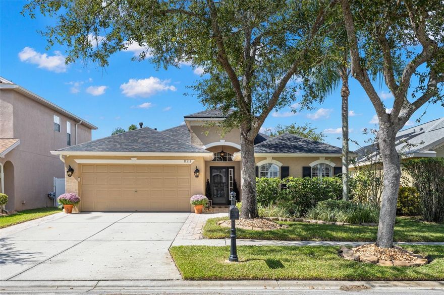 Located in the desirable gated community Sheffield of Westchester, this 3-Bedroom 2-Bath split floor plan home has been meticulously maintained with tasteful upgrades. The kitchen boasts granite countertops with a breakfast bar overlooking the great room, white cabinets and stainless-steel appliances. Bathrooms have been upgraded with new tile, cabinetry, quartz countertops, and plumbing fixtures. Additional upgrades include bamboo flooring, plantation shutters, water softener, new sliding glass door, custom cabinets in owner’s suite closet and bathroom, garage racks, outdoor shed, storm door, landscape lighting, and a new roof was installed 7/2024. Spending time outdoors will be relaxing on your screened-in back porch or on your large paver patio with sunshade. The backyard is complete with vinyl fencing, outdoor lighting and mature tropical landscaping and has plenty of room to play. The Sheffield of Westchester Community features no CDD fees, low HOA dues, reclaimed water for lawn irrigation, two playgrounds, and a secure gated entrance. It is perfectly located minutes from groceries, restaurants, and highly rated schools. This home provides unparalleled convenience to the Veterans Expressway, Tampa International Airport, and vibrant Downtown Tampa.