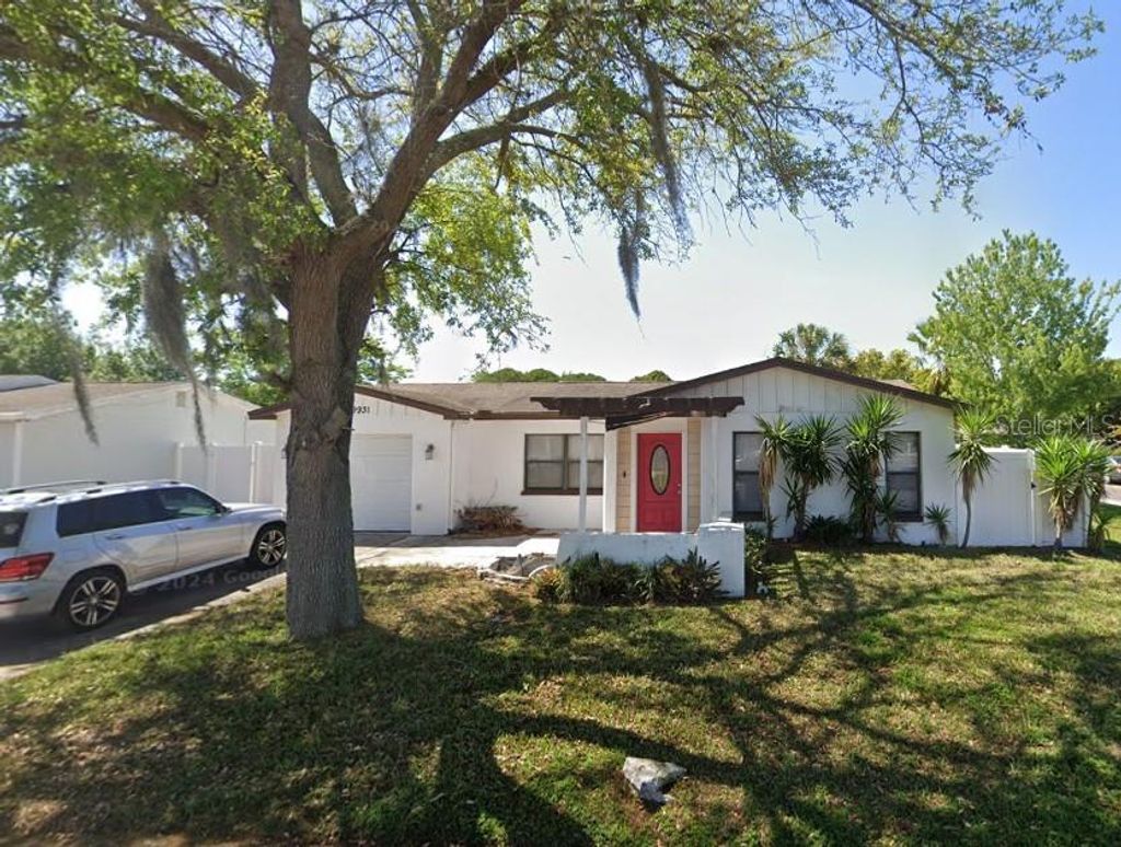 Photo of 9931 Woodstock Lane, Port Richey, FL 34668 (MLS # W7881449)