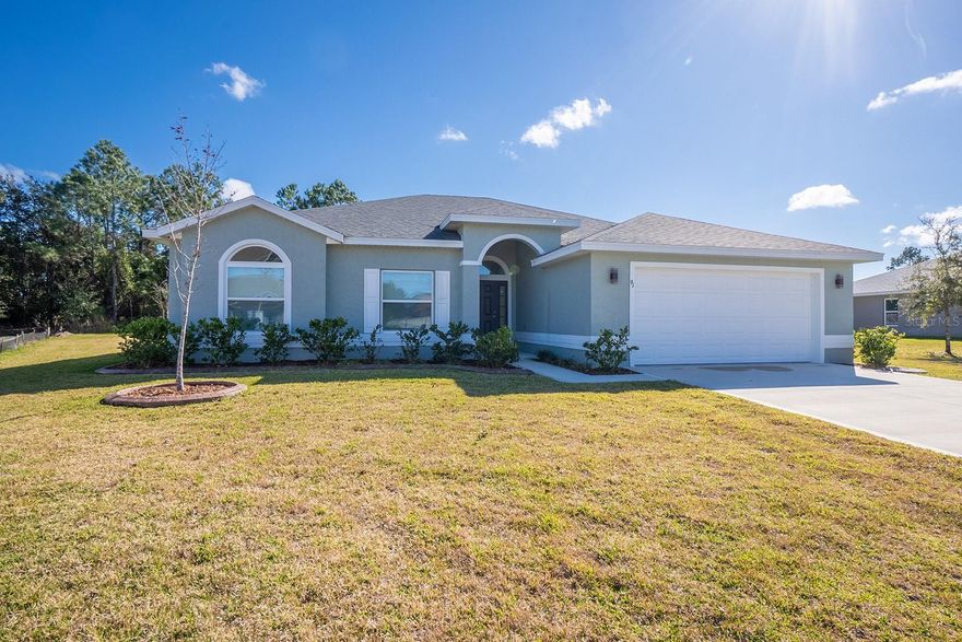 One or more photo(s) has been virtually staged. Beautiful, never-lived-in Seagate Captiva II with a split floor plan. Built in 2024, this home features 3 bedrooms and 2 baths on an oversized private lot in the desirable Palm Harbor neighborhood, also known as the “F” section. The kitchen boasts stainless steel appliances, granite countertops, and an island that overlooks the spacious great room and large covered lanai. Ceramic tile flooring runs throughout all main living areas, with carpeting in the bedrooms.The private owner’s suite includes a generous walk-in closet, walk-in shower, and dual sinks. The backyard backs to a preserve, offering extra privacy and a peaceful natural view, with room for a pool. Enjoy the convenience of nearby shopping and dining, walking and bike paths, along with quick commutes via I-95, all just minutes away. Flagler Beach is also only minutes away, known for its laid-back atmosphere, local charm, and beautiful shoreline. This is a home that truly stands out—modern, move-in ready, and packed with value. Schedule your private tour today!