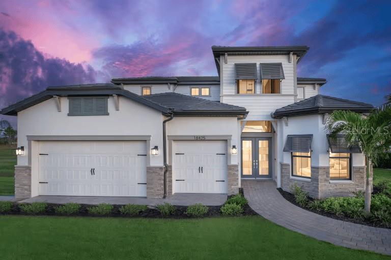 The Layton and Layton Grande models by DiVosta-Pulte in BeachWalk by Manasota Key combine spacious design, quality construction, and resort-style living just minutes from the Gulf. Ranging from roughly 2,970 to nearly 4,000 square feet, these homes offer three to five bedrooms, three-and-a-half to four-and-a-half baths, and a three-car garage. Open-concept layouts connect the gathering room, kitchen, and café area, with large sliding doors that expand living space to the lanai for seamless indoor-outdoor entertaining. The primary suite features a generous walk-in closet and spa-inspired bath, while flexible spaces like lofts, dens, or additional bedrooms adapt to a variety of lifestyles. Built with concrete block construction, impact-resistant windows, and tile roofs, the homes are designed with Florida’s climate in mind. Interior finishes include tile in main living areas, eight-foot doors, designer kitchens with stone countertops and stainless appliances, and energy-efficient features throughout. Set within the gated BeachWalk community, residents enjoy resort amenities, nearby beaches, and easy access to shopping and dining, making the Layton and Layton Grande models a perfect blend of comfort, style, and coastal convenience.