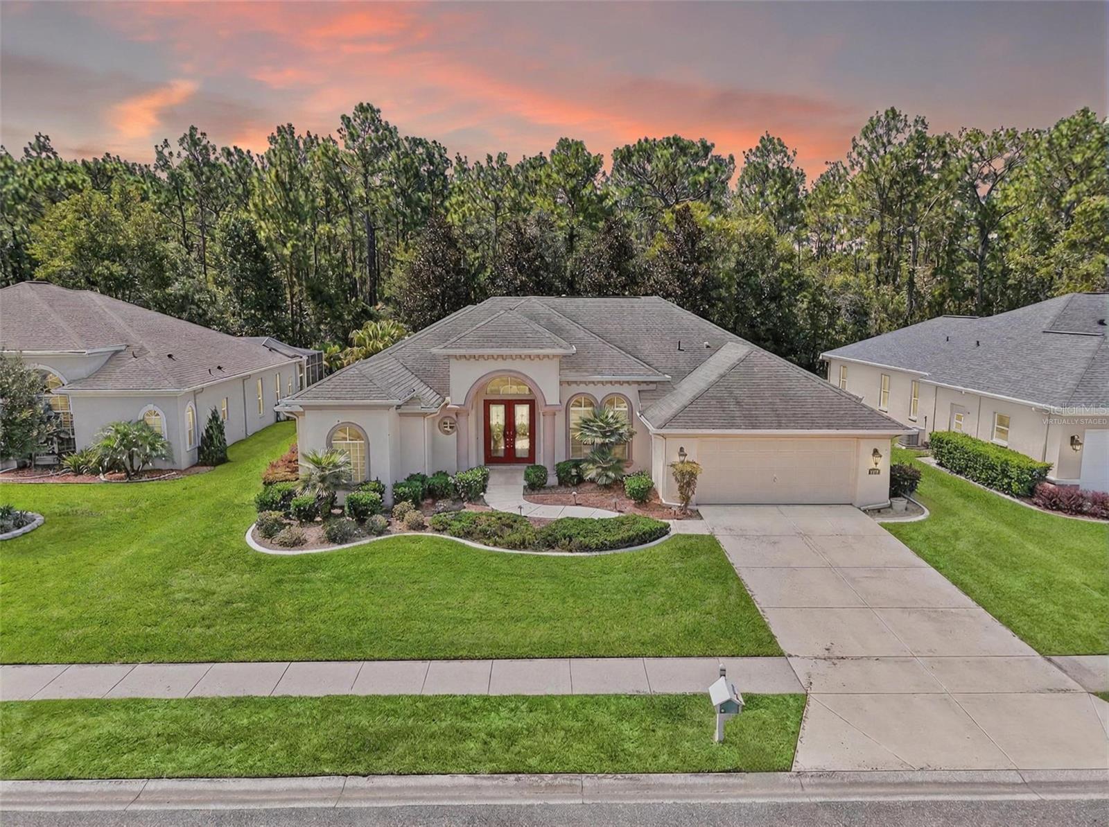 Welcome to 5378 Legend Hills Lane, a beautifully appointed home nestled in the Silverthorn Golf & Country Club—one of Hernando County’s most desirable gated communities. This stunning residence blends refined style with relaxed Florida living and is set on a beautifully landscaped lot with incredible curb appeal and a spacious 3-car tandem garage.
Step through the double front doors into a grand foyer with double tray ceilings, formal living and dining rooms, and views straight out to your private courtyard oasis. At the heart of the home, a dual-sided gas fireplace adds warmth and charm to both the living room and family room, while plantation shutters and elegant architectural details elevate the space throughout.
The open-concept kitchen features a breakfast nook and seamlessly connects to the family room, which showcases a custom built-in entertainment center and oversized picture window framing the resort-style pool area. Outside, enjoy a heated saltwater pool surrounded by a privacy wall, lush landscaping, and a covered lanai with a poolside kitchenette, electric retractable awning, and a dedicated pool bathroom—perfect for entertaining. A pool safety fence is also included for peace of mind.
The thoughtfully designed split floor plan offers maximum privacy, with the primary suite located on one side of the home featuring direct access to the pool and patio, while three spacious guest bedrooms are situated on the opposite side.
Whether you're hosting summer BBQs, relaxing under the awning, or enjoying a morning walk around the scenic community, this home offers the lifestyle you’ve been looking for in a golf course setting.
Don't miss your chance to live in Silverthorn—where elegance meets everyday comfort.