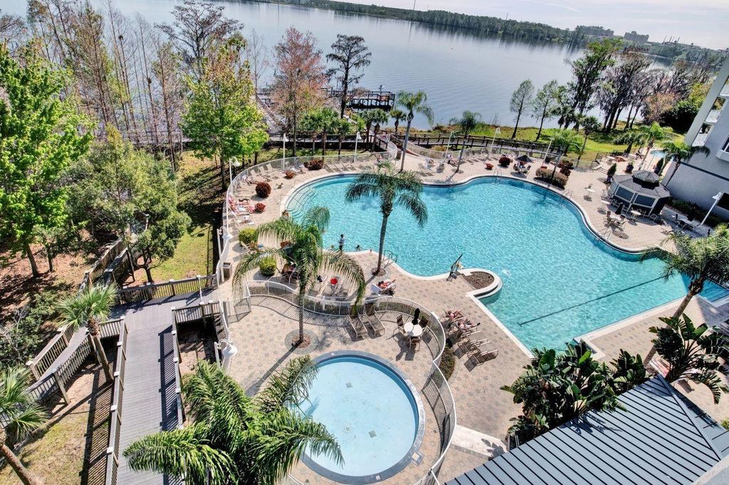 Photo of 13415 Blue Heron Beach Drive #402, Orlando, FL 32821 (MLS # O6363049)