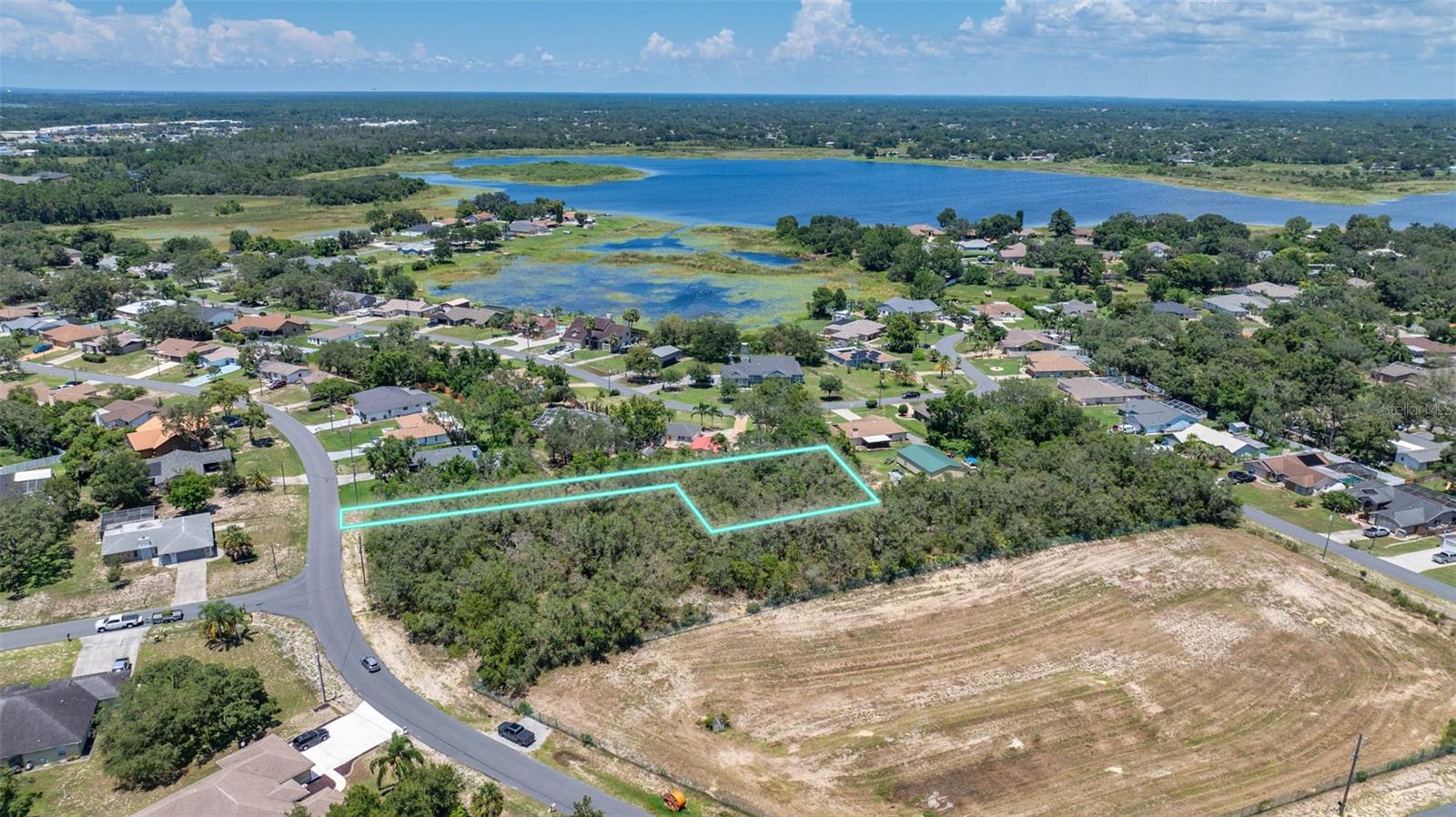 Prime Approx.. Half-Acre Lot NO HOA or CDD Fees– Build Your Dream Home! Discover the perfect opportunity to build your dream home on this approximately half-acre vacant lot in a desirable location! Nestled in a peaceful and private setting, this property offers a rare combination of seclusion and convenience. Located just minutes from the Suncoast Parkway, you’ll enjoy quick and easy access to all Tampa Bay areas. This spacious lot provides the ideal canvas for your custom home, with plenty of room for outdoor living, a pool, or additional structures. Enjoy the best of Florida living with proximity to hospitals, beautiful Gulf beaches, shopping, dining, and endless entertainment options. Don’t miss your chance to own a piece of Florida paradise. Whether you’re ready to build now or invest for the future, this property checks all the boxes!