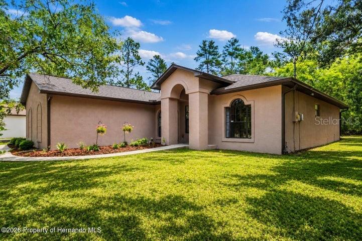 One or more photo(s) has been virtually staged. his is the HALF-ACRE AND PRIVACY everyone is looking For -- 3 Bedrooms, No HOA, Newer Roof, Newer AC, Move-In Ready. The section of Royal Highlands everyone wants -- and this is the lot that makes people stop scrolling. 

HALF AN ACRE. Completely private. No rear neighbors. No HOA telling you what to do with your own land. No CDD. No flood insurance. And a peaceful, quiet setting that somehow puts you just minutes from SR 50, all the shopping and dining you need, and a quick on-ramp to the Suncoast Parkway. 

The home has been updated where it counts. RENOVATED KITCHEN with GRANITE COUNTERTOPS, SUBWAY TILE BACKSPLASH, BREAKFAST BAR, and PANTRY. RENOVATED BATHROOMS. NEW ROOF (2021). NEW AC (2021). Nothing to do but move in. 

Inside, the OPEN FLOORPLAN flows through a HUGE GREAT ROOM and FORMAL DINING -- the kind of layout people actually live in. The PRIMARY SUITE is its own retreat with DOUBLE SINKS, WALK-IN SHOWER, a MASSIVE WALK-IN CLOSET, and its own PRIVATE SCREENED REAR PORCH. Two rear lanais. Because one wasn't enough. STORAGE SHED. SIDE-ENTRY GARAGE. 

Private from the road. Zoned for WINDING WATERS K-8 and WEEKI WACHEE HIGH SCHOOL -- two of the newest schools in the county. This is the lot, the location, and the upgrades -- all at the same address. Those don't come around often!!!