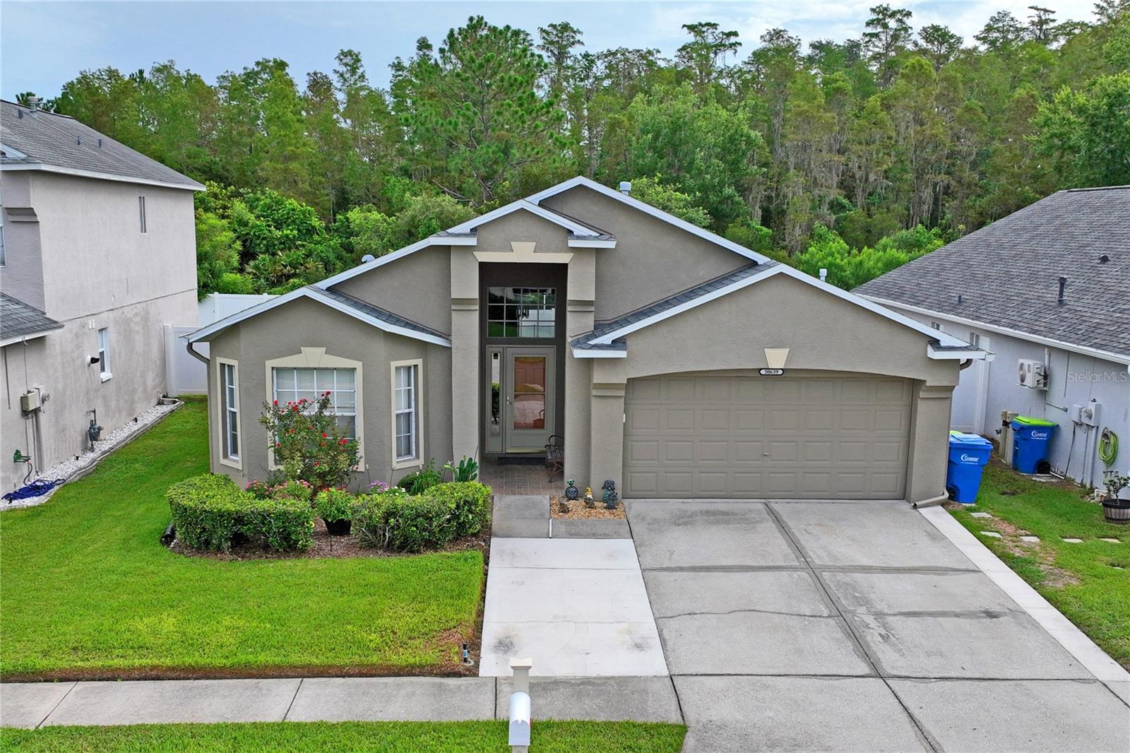 4 Bedroom, 3 Bath, 2 Car garage with 3 car driveway, fenced in pool home located on a conservation homesite in the Village of Wrencrest in the desirable community of Meadow Pointe II. The club house is located a few blocks away and has a fitness center, pool, splash pad, playground, tennis courts and basketball courts. As you walk into the home, you are welcomed by a large open living room that has vaulted ceilings and double door sliders that open to the screen enclosed pool area. The home has a split floor plan lay out for ultimate privacy. ( see floor plan ) The kitchen has a sitting area, a washer & dryer closet, closet pantry and a breakfast bar that opens to the living room. The dinning room / Den is located across from the Kitchen. The primary bedroom has a slider that opens to the pool area, an ensuite bathroom with double vanities, large tub and a shower stall. The other 3 bedrooms are located to the left side of the home. Bedroom 2 and 3 share a Jack and Jill bathroom. Bedroom 4 is located towards the front of the home and has a bathroom next to it. No need to worry about power outages because the home has a whole house generator. Roof was replaced on 2020 and has hurricane shield underneath, A/C replaced on 2020 and has had yearly maintenance . Home is located within easy access to I-75, I-275, SR 56, Wiregrass Mall, Premium Outlet Mall, USF, Pasco Hernando State College, minutes away for top rated schools, Hospitals, Medical facilities and many Restaurants. ** Click on Virtual Tour to see a 3D walk Thru of home and Video view of community** Call for your private showing.