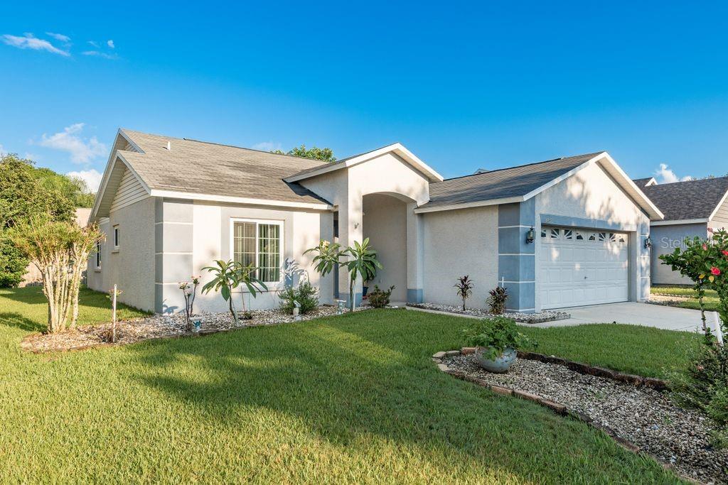 Come see this very nice home in sought after Beckett Bay neighborhood!!! Impeccably maintained three bedroom, two bath residence with two car garage is ready to go!! Split plan includes Primary bedroom en suite with private bath and walk-in closet and two guest rooms with guest bath. A large kitchen with breakfast bar and pantry features granite counters and lots of space including dining area. The living room looks out through sliding glass doors through the covered patio into a large landscaped yard. Roof is 2019 and impact windows have been installed in 2021.Beckett Way Amenities include Community pool, playground, and small dog park area. Ridge Shore Drive is minutes away from Downtown Tarpon Springs where you can enjoy the iconic Sponge Dock area and its restaurants and pubs. Also nearby is Fred Howard park with its picnic areas, beach and causeway. Just South is Dunedin and Clearwater, both destinations in their own right! Welcome to Paradise!