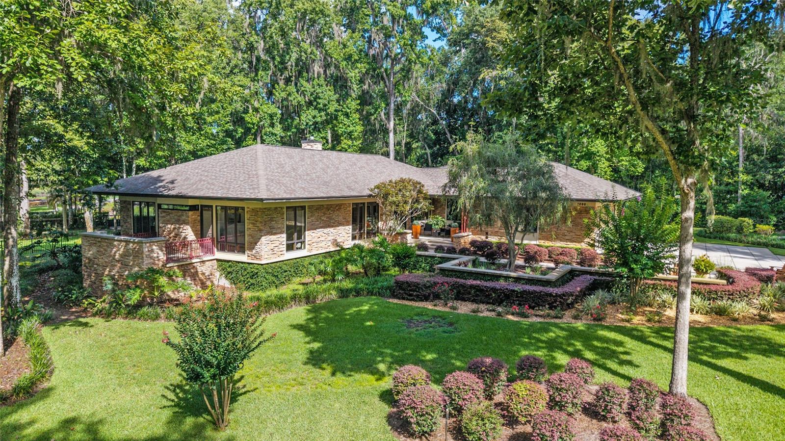 Unique impeccable Frank Lloyd Wright’s design incorporating nature into design. Only home with highly sought after waterfall views. Timeless Architecture! Discover your move in ready dream home with this exquisite 3-bedroom, 3.5-bath and an office featured in this contemporary style home for sale in the highly sought-after Country Club of Ocala. This luxury Ocala home features immaculate interiors with an open floor plan, a home den/theater/second living room and travertine floors, perfect for family living and entertaining. Flooded with natural light from numerous full-pane windows, the residence showcases stunning millwork in the ceilings, a lavish master suite with a spa-like bathroom including a soaking tub and separate shower, and a chef’s kitchen equipped with custom appliances and custom cabinetry. The home seamlessly blends indoor and outdoor living spaces, creating an ideal environment to relax and enjoy the beautiful Central Florida climate. Additional highlights include an open fireplace, meticulous attention to detail throughout, and access to exclusive community amenities. Whether you’re seeking a family-friendly home or a sophisticated space for entertaining, this exceptional property in the Ocala real estate market offers unparalleled luxury and comfort without the requirement of golf and/or social membership, its an option. Don’t miss the opportunity to own this stunning contemporary home in Country Club of Ocala and experience the best of Central Florida living.