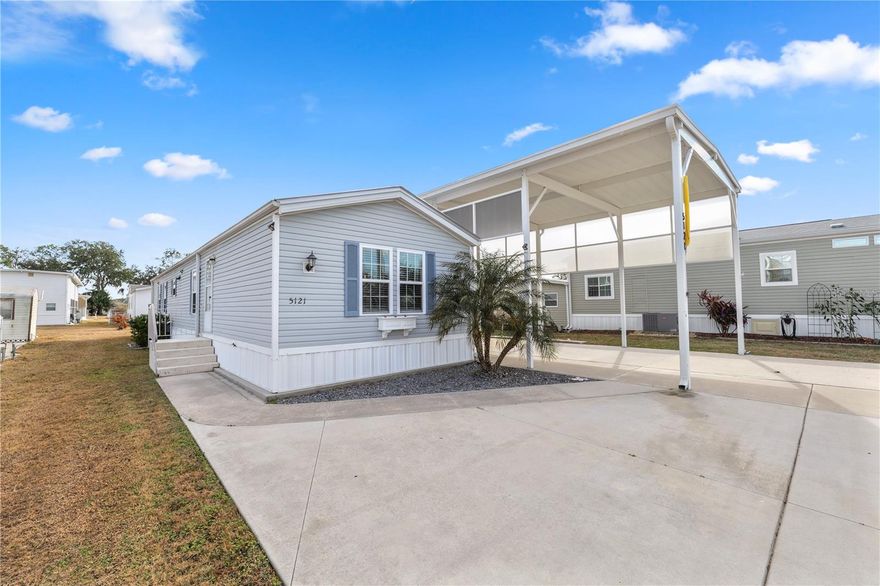 Here's your opportunity to live in the much sought after deed restricted Mount Olive Shores South! This entirely updated property comes with an oversized RV Port that should accommodate even the largest of motor homes with slides outs. Measures 50x17 ft. Ample parking for extra cars, boat, ect. w/extended drive. Many updated features on this 2BR2Bath home completed since 2020: Totally remolded kitchen w/an abundance of residential custom cabinets including a breakfast bar, two pantries, granite countertops, LG appliances w/gas range, Farmhouse sink. upgraded faucets, Oversized MB with new custom tiled & glass walk in shower, ON DEMAND gas hot water heater, new metal roof, new blinds & ceiling fans. Includes all furniture present, walk in closets, extra large storage barn, extended Port over shed & back patio. You must own a class A Motorhome to purchase here.
