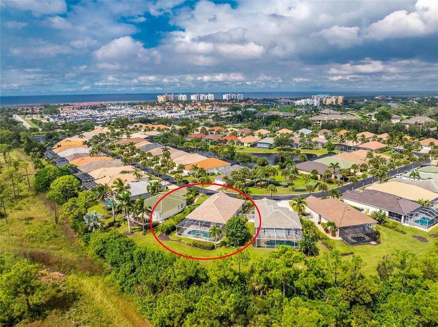 Perfectly positioned residence offers a SW facing pool with tranquil natural preserve backdrop that offers exceptional privacy and a true sense of Florida relaxation. Welcome to this impeccably maintained two bedroom plus den Everett floorplan home with a NEW ROOF in the sought-after neighborhood of Courtside Landings neighborhood in Burnt Store Marina. Step inside to find an incredible light-filled home with volume ceilings, abundant windows and sliding doors, and an open layout that seamlessly connects indoor and outdoor living. This fully furnished home boasts tasteful architectural features including accent niches, and archways accentuated with a pleasing color palette and quality furnishings. Striking pool views can be enjoyed from the main living space as well as the stylish and functional kitchen, with wood cabinetry, stainless steel appliances, a large breakfast bar, and a casual dining nook. Glass sliding doors invite you to step out to the side courtyard. A separate dining area provides the perfect space for hosting family and friends. Outside, you’ll enjoy a free-form pool and spa surrounded by a spacious sun-drenched pool deck with plenty of elbow room, offering room for multiple covered seating areas.This space is ideal for lounging, dining, or entertaining amid the peaceful private preserve setting. The primary suite located at the back of the home is a private retreat complete with plantation shutters, a French door leading to the pool, walk-in closet, and handsome ensuite bath featuring dual sinks, a jetted tub, and a separate frameless shower. The comfortable guest room is located at the front of the home with an adjacent full bath with a delightful den for overflow guests, or home office. Additional highlights include garage screens, full home hurricane protection including roll down and accordion shutters, and a quality turnkey furnishing package allowing you to move in and start enjoying the resort lifestyle right away. Located within walking or biking distance to Cass Cay waterfront restaurant, the marina, and fitness center, this home offers the perfect blend of comfort, convenience, and coastal charm inside Burnt Store Marina’s vibrant gated community.