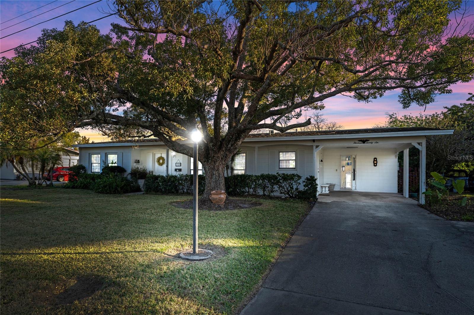 MULTIPLE OFFERS RECEIVED. HIGHEST AND BEST DUE BY 5PM MONDAY 1/13. WATERFRONT HOME. PRICED UNDER MARKET VALUE. MOVE IN READY. This home is full of potential for a new owner to make it their own. This split floor plan home features a fantastic layout, open living room with beautiful water views, and oversized lot for your backyard oasis! The bedrooms are spacious and well lit, there is ample storage and newer vinyl flooring. The canal/pond in the back makes this lot extremely desirable for peaceful sunsets on the waterfront, backyard BBQs and more. The home also features an oversized driveway for extra parking and large storage shed. Under the current flooring is Terrazzo for a potential mid-century modern feel!