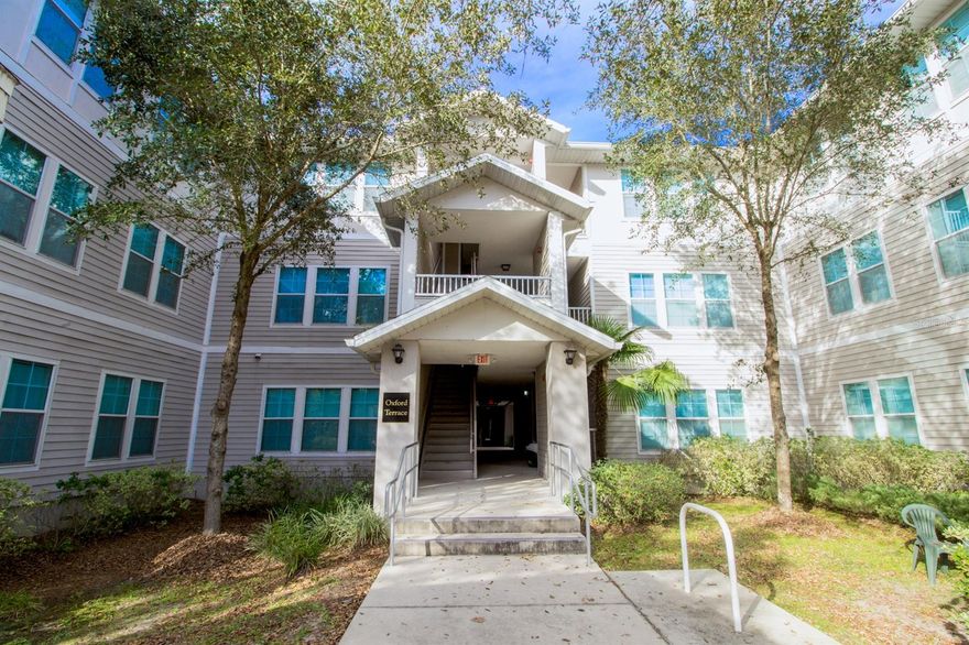 Just three blocks from UF and one block from Sorority Row, this top-floor end-unit luxury condo is packed with upgrades including granite countertops and stainless steel appliances. The open living, dining, and kitchen floor plan features French doors that lead to a covered patio, while each of the spacious bedrooms includes its own private bathroom. The unit is furnished in the common area, washer and dryer are included, and the home boasts a 2021 HVAC system with a 10-year warranty along with a new roof completed in 2024. Association dues cover bulk cable and ultimate high-speed internet, and residents enjoy an electronically gated scooter and bike cage on the ground floor as well as a bus stop directly outside the community for quick access to campus. Fully rented through July 31, 2026 at $2,700/month, with a buyer’s insurance policy of just $46 per month, this condo is a sharp, move-in-ready investment opportunity.