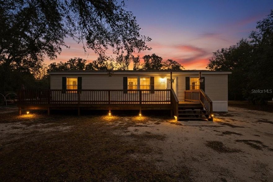 One or more photo(s) has been virtually staged. Secluded Convenient & Affordable. If you crave the calming sights & sounds of wildlife & woodlands then this 2021 Townhome set on 1.25 acres is the one for you! When you turn onto 90th street you will feel the privacy envelope you. The home is just .4 of a mile on your right. Your view from the front of your home is the expansive Goethe Forest, providing the privacy & remote feel. Opportunities for hiking, 4 wheeling & wildlife watching abound! The newer front deck draws you into the Townhome while providing a delightful space for cookouts & morning coffee. The Townhome invites a life of comfort & tranquility with the large Great Room & Open Concept flow. The Kitchen features a large bakers island with dual outlets, cabinetry & built in bookcase. Perfect for all your culinary creations! The best feature is the "hidden" oversized Pantry. Here is where your Homesteading goods have their home. The Split Plan concept creates a soothing "retreat"-the Primary Suite is separate from the Guest Wing & boasts a large sleeping area, walk-in closet & a spa like En-Suite Bath. Double sinks, a soaker tub with frosted window, a large linen cabinet & separate shower with seat provide a much needed respite after a long day. The En-Suite Bath is accessed by the Laundry Room as well which makes for easy clean up after working outside. The Guest Wing affords comfort with two bedrooms with walk in closets that share a well appointed guest bath. (Some photos are virtually staged to provide ideas for use of room space.) Outside there is a newer 10x16 Storage Building to house your equipment & double as a workshop space. A rustic entertainment area, raised garden beds, a fire pit & a Chicken Coop are ready for you to make your own. You are free to cultivate your Homestead as there is no HOA. The location complements the property in that the town of Bronson is a quick drive for shopping & dining & Gainesville is a straight run on SR 24 from the University Estates Community. Levy County is a natural paradise, home to the beautiful Suwannee River & numerous local Springs & attractions, affording ample opportunities for outdoor adventure. Come embrace the lifestyle you deserve. Call today for your personal tour.