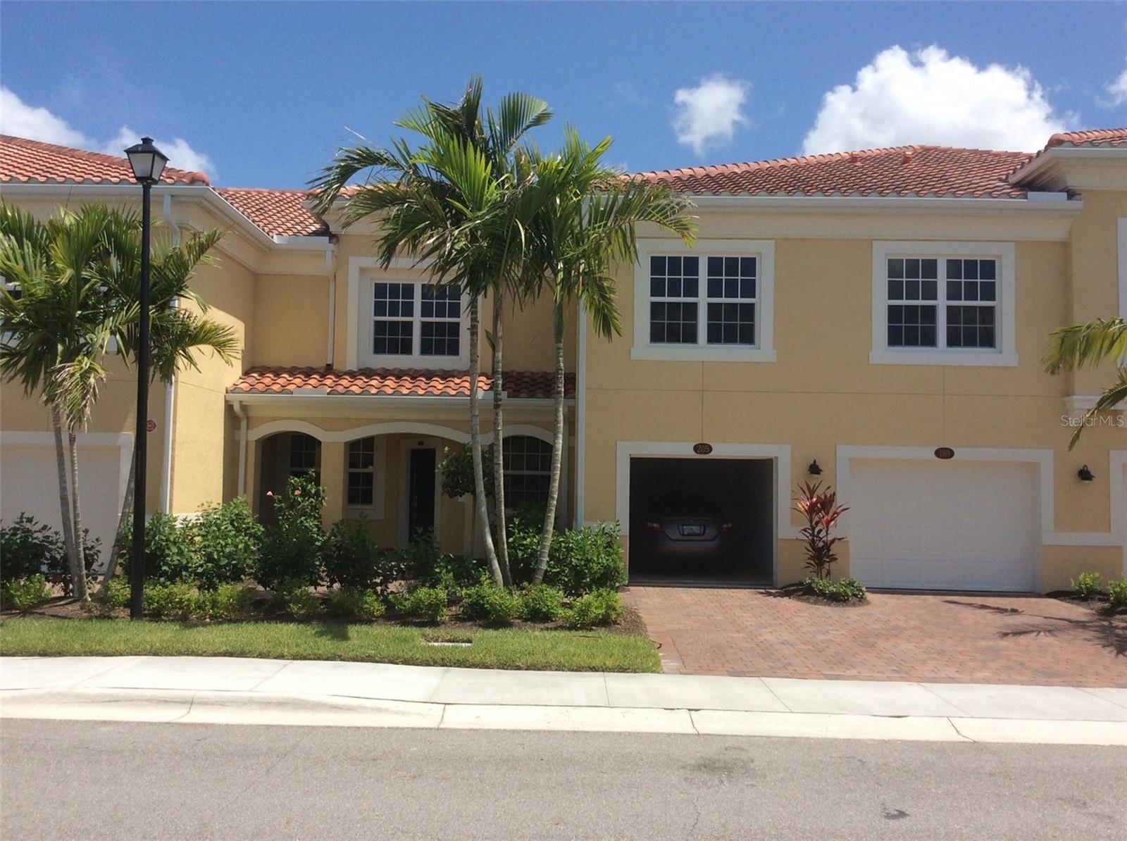 town home style condo at Bay Street, with beautiful lakefront view. Enjoy coastal breezes & the Florida lifestyle in maintenance free community. open design concept with great room, kitchen & dinning on the 1st floor, Cherry spice cabinets, stainless appliances, granite counter tops, with a private covered entry porch & 2 separate garages. Luxury waterproof floor on the second floor. Master suite with double vanity, tiled walk-in shower, and walk in closet. community amenities include gated access, heated resort style pool, fitness room, & club room. located between downtown sarasota and Venice. You will enjoy living so near to the legacy Trail, Oscar Scherer Park, beautiful gulf coast beaches, and dining and shopping venues. all zoned schools have good rating.