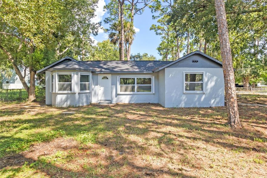 *Seller willing to contribute up to 3% toward buyer’s closing costs.* Welcome to this beautifully updated 3-bedroom, 2-bath home with 1,199 square feet of comfortable living space on an oversized corner lot, where thoughtful upgrades and modern touches create a move-in-ready retreat. A charming custom fireplace anchors the living room, while the kitchen shines with new appliances and a stylish backsplash. The master suite provides a serene escape, featuring a fully updated bathroom and a custom closet system for optimal organization. Throughout the home, you’ll find fresh light fixtures and new blinds that add warmth to every room. A convenient laundry room comes complete with a washer and dryer, and a brand-new shed provides extra storage or workspace. For peace of mind, hurricane shutters are in place to protect your investment. From its inviting interior to the carefully planned updates inside and out, this property is ideally suited for comfortable Florida living.