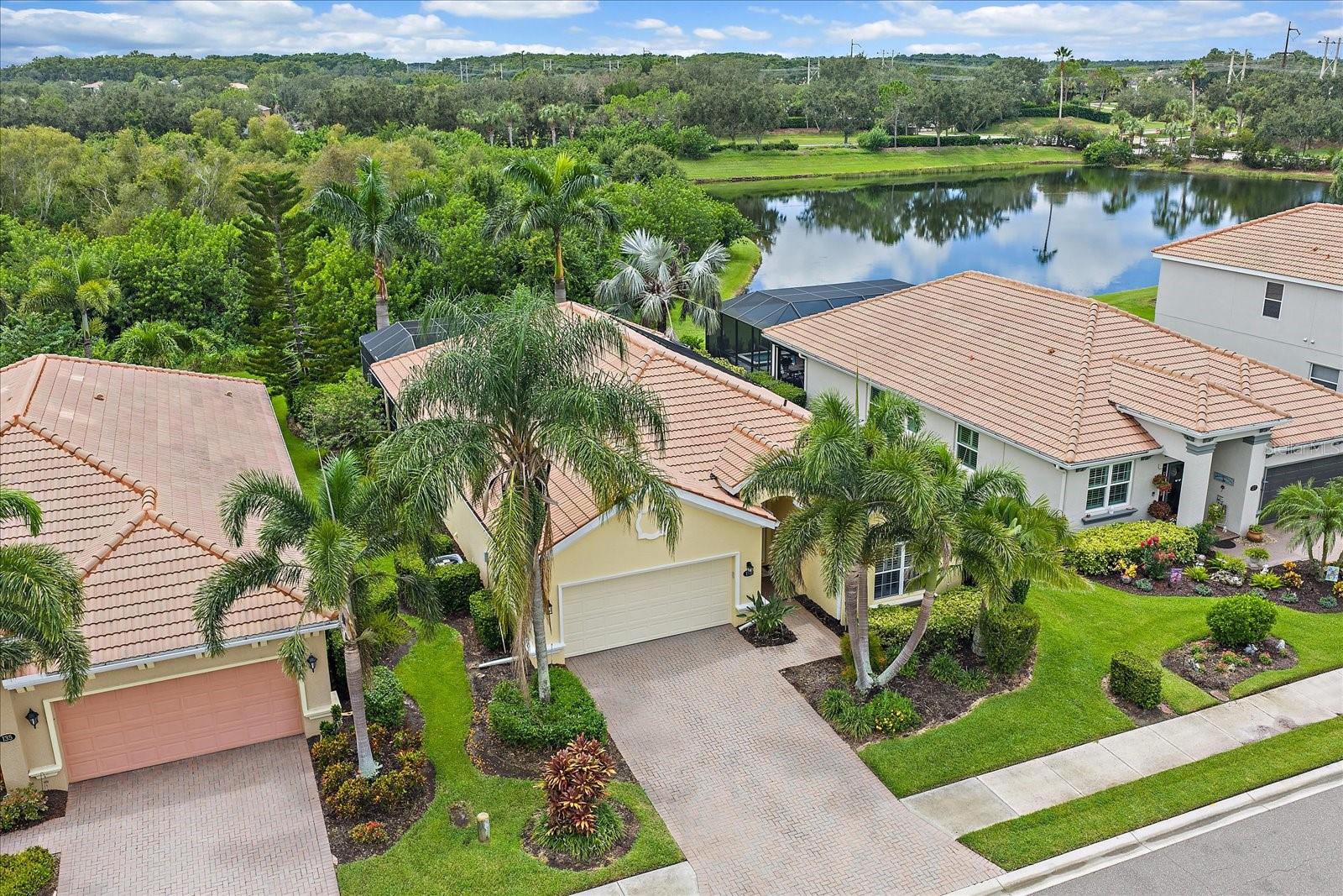 This single-family home built within the community of River Strand Golf and Country Club is located in the well manicured master planned community of Heritage Harbour. Designed with nearly 2000 square feet of indoor living space, the floor plan connects every room with effortless flow and is perfect for hosting game night! Pull up a chair in the heart of the home with a warm and inviting kitchen, complete with quartz countertops and ample storage for all your culinary needs. The home offers three bedrooms and two full baths, providing an inviting retreat for family and guests. Enjoy the private, screened-in lanai that captures the essence of Florida outdoor living! There is plenty of space and sunlight for patio gardening. During sunsets, you'll appreciate the layout and indulge in the ultimate moments of relaxation while unwinding in the sparkling pool and spa surrounded by the uplight landscaping and background featuring a sliver view of the pond next to the preserve. Home includes deeded golf to 27 holes designed by Arthur Hills and as a resident of River Strand, owners have access to an incredible array of amenities including an activities director, state-of-the-art fitness centers, multiple pickleball and tennis courts, tiki bar, clubhouse, dining and a vibrant social calendar designed to connect you with your neighbors. River Strand is more than a place to live; it's a place where dreams of living on the Suncoast of Florida become a reality!