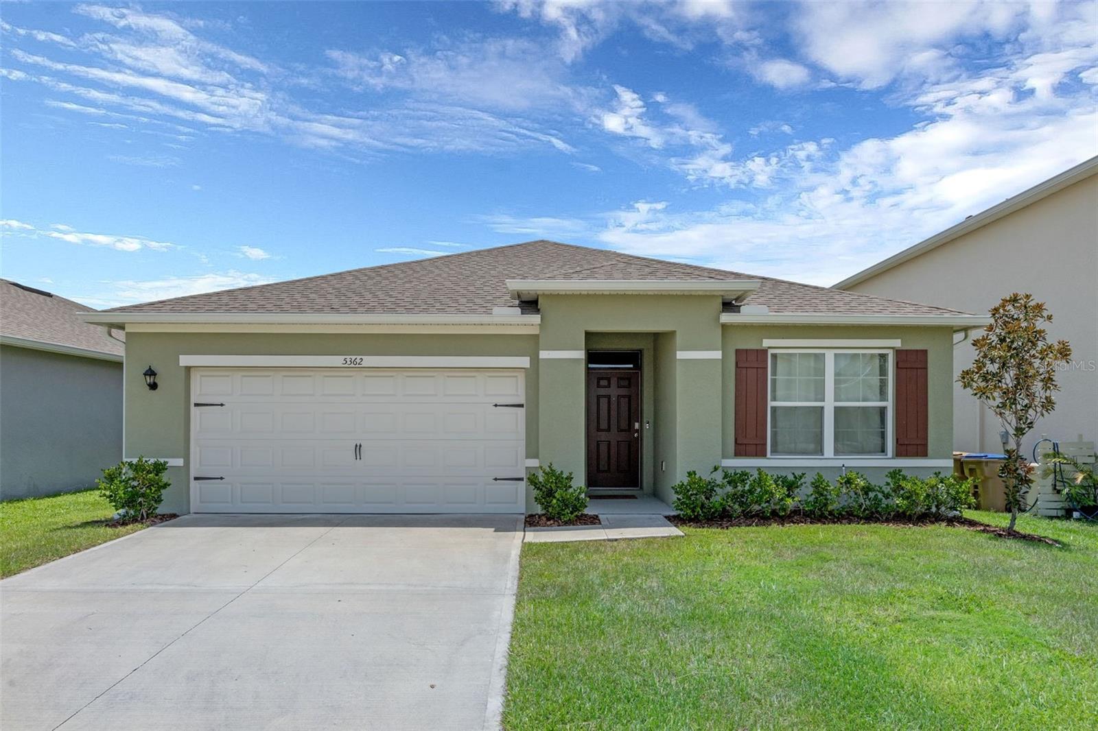 Welcome to 5362 Douglas Fir Drive, a beautifully maintained single-story home located in the Glenwood community of Saint Cloud—just 10 minutes from Lake Nona and the Narcoossee Corridor, one of the fastest-growing areas in the country. Built in 2022, this 3-bedroom, 2-bathroom home offers 1,672 sq. ft. of comfortable, modern living with an open-concept layout perfect for entertaining. The kitchen features white cabinetry, granite countertops, a large island, and a direct view of the living and dining areas, all accented by tile flooring in the main spaces and carpet in the bedrooms. The spacious primary suite includes a walk-in closet and en-suite bath. Enjoy the outdoors in your covered lanai—ideal for relaxing, sipping your morning coffee, or hosting a backyard BBQ. The home is just a short walk from the community pool. Glenwood offers a peaceful setting with low HOA fees and no CDD. You're minutes from top-rated schools, the newest Publix, Boggy Creek Rd, 417, and Highway 192, which provides easy access to Florida’s East Coast beaches. Enjoy the best of Lake Nona living, with Boxi Park, USTA, Don Julio, Pisco Peruvian Gastrobar, Nona Blue, and Michelin-starred Bacán just a short drive away.