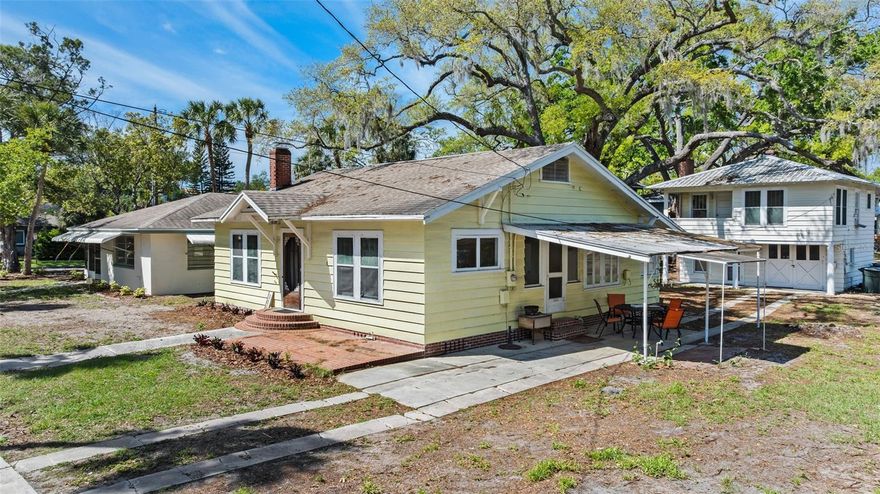 One or more photo(s) has been virtually staged. Iconic Downtown Opportunity | Live, Invest, or Create Your Dunedin Compound
Positioned at the corner of President St and Broadway St., this exceptional 0.53-acre property offers a rare opportunity in the heart of Dunedin. Just steps from the Pinellas Trail, two blocks to the marina, and a short stroll to Main Street’s renowned dining, shops, and waterfront, this location delivers the ultimate blend of charm, walkability, and lifestyle.
Zoned MF-7.5 with potential for up to four residential units, the property presents a unique canvas for a luxury compound, boutique development, or thoughtfully designed multi-residence retreat. Whether envisioned as a private family estate with guest homes, a seasonal coastal getaway, or a long-term hold with income, the flexibility here is what makes it special.
Three points of access (President St, Broadway, and rear alley) provide a level of optionality rarely found in downtown parcels—ideal for both future development and functional day-to-day living.
The grounds are anchored by majestic century-old Live Oaks, creating a timeless Old Florida setting that enhances both privacy and character. Existing improvements include three income-producing structures: a charming 2BR/2BA bungalow, a well-maintained 2BR/1.5BA ranch with terrazzo floors, and a 1BR/1BA garage apartment—offering immediate cash flow, multigenerational living, or the ability to live on-site while designing your vision.
Located in a sought-after golf cart district near TD Ballpark and the Dunedin Marina, this is a premier offering for those seeking a signature property in one of Tampa Bay’s most desirable coastal communities. The location is A+++ and demand for well-executed new construction in downtown Dunedin continues to grow. 
No short-term rentals permitted in this neighborhood. Buyer to verify all zoning, use, and development details.