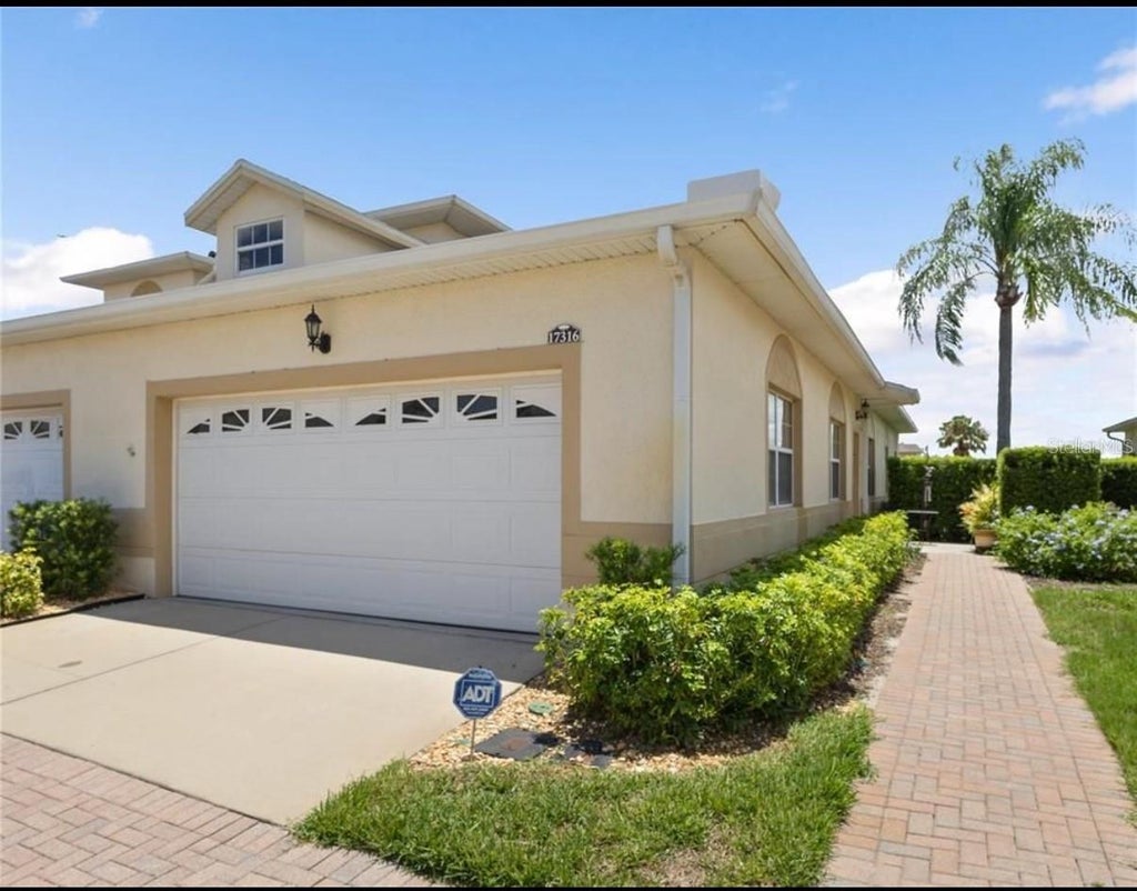 Photo of 17316 Chateau Pine Way, Clermont, FL 34711 (MLS # S5159086)