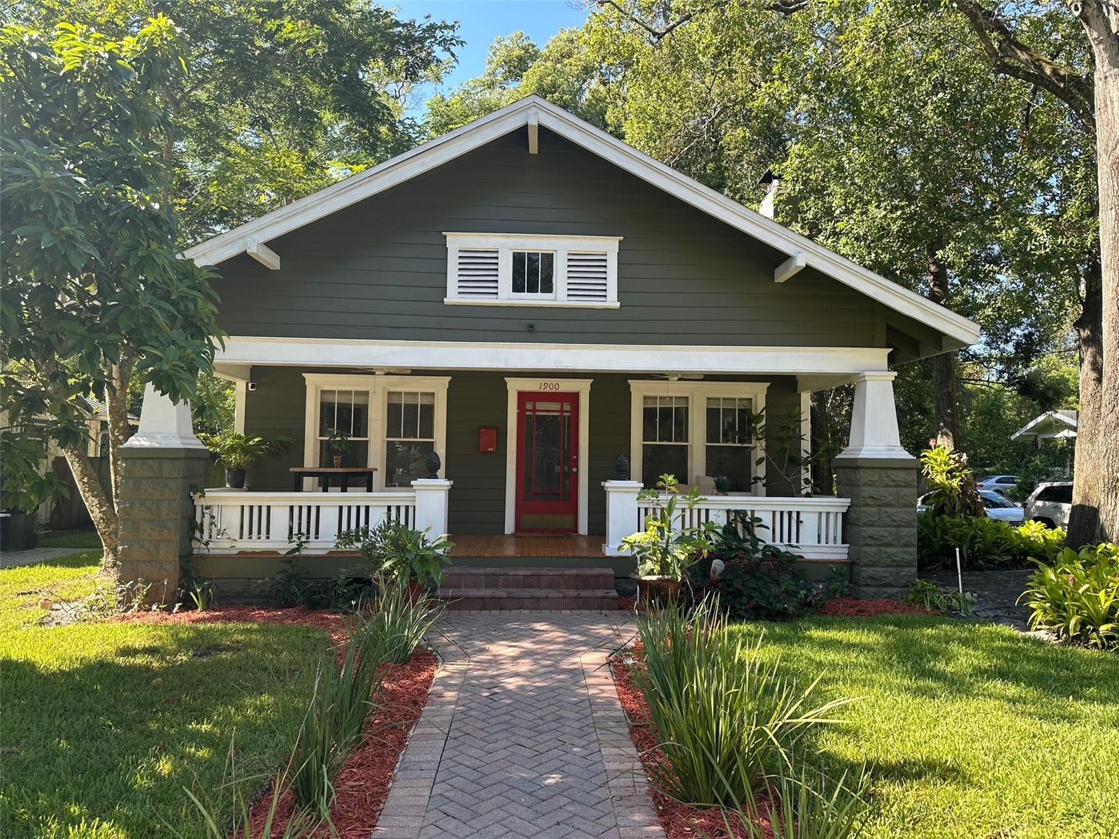 A Rare Craftsman Gem in the Heart of Colonial Town North!
Welcome to 21st-century living wrapped in timeless 20th-century charm. Nestled on an oversized corner lot along a quiet, brick-lined street, this beautifully maintained Craftsman-style property is just a short stroll from Lake Highland Prep and the vibrant dining, shopping, and cultural experiences of the Mills/50 District. This property description includes an unexpected, separated and extraordinary cottage with high wow-factor.
Step onto the wide, covered front porch—complete with new hardwood decking and twin ceiling fans—and into a home where character meets comfort. Inside the main residence, newly refinished hardwood floors flow throughout a warm, light-filled interior featuring two spacious bedrooms and a smaller third bedroom perfect for a home office or nursery. The inviting living room centers around a cozy wood-burning fireplace, while the generous dining room sets the stage for memorable gatherings.
The updated kitchen includes a charming eat-in booth, new refrigerator and dishwasher, and plenty of room for culinary creativity. Outside, the magic continues: an expansive, fully irrigated yard shaded by majestic oak trees, lush landscaping, mature fruit trees—including avocado trees —and a brand-new, show-stopping deck. This outdoor sanctuary features automatic low-voltage lighting, built-in underlit bench seating, and café string lights that transform the backyard into an enchanting evening retreat.
At the rear of the property, a beautifully designed 1-bed, 1-bath guest home offers exceptional flexibility—ideal as an income-producing ADU, private MIL suite, or additional space for entertaining. Thoughtfully designed to maximize every inch, it boasts a full kitchen, in-unit washer/dryer, sleek under/over-cabinet lighting, and all appliances are included.
With a new roof (2021), two newer water heaters, updated appliances, and a large storage shed, this is a move-in-ready opportunity that rarely comes along.
Whether you're looking for multi-generational living, income potential, or simply a unique slice of Orlando history with all the right updates, this home truly has it all.