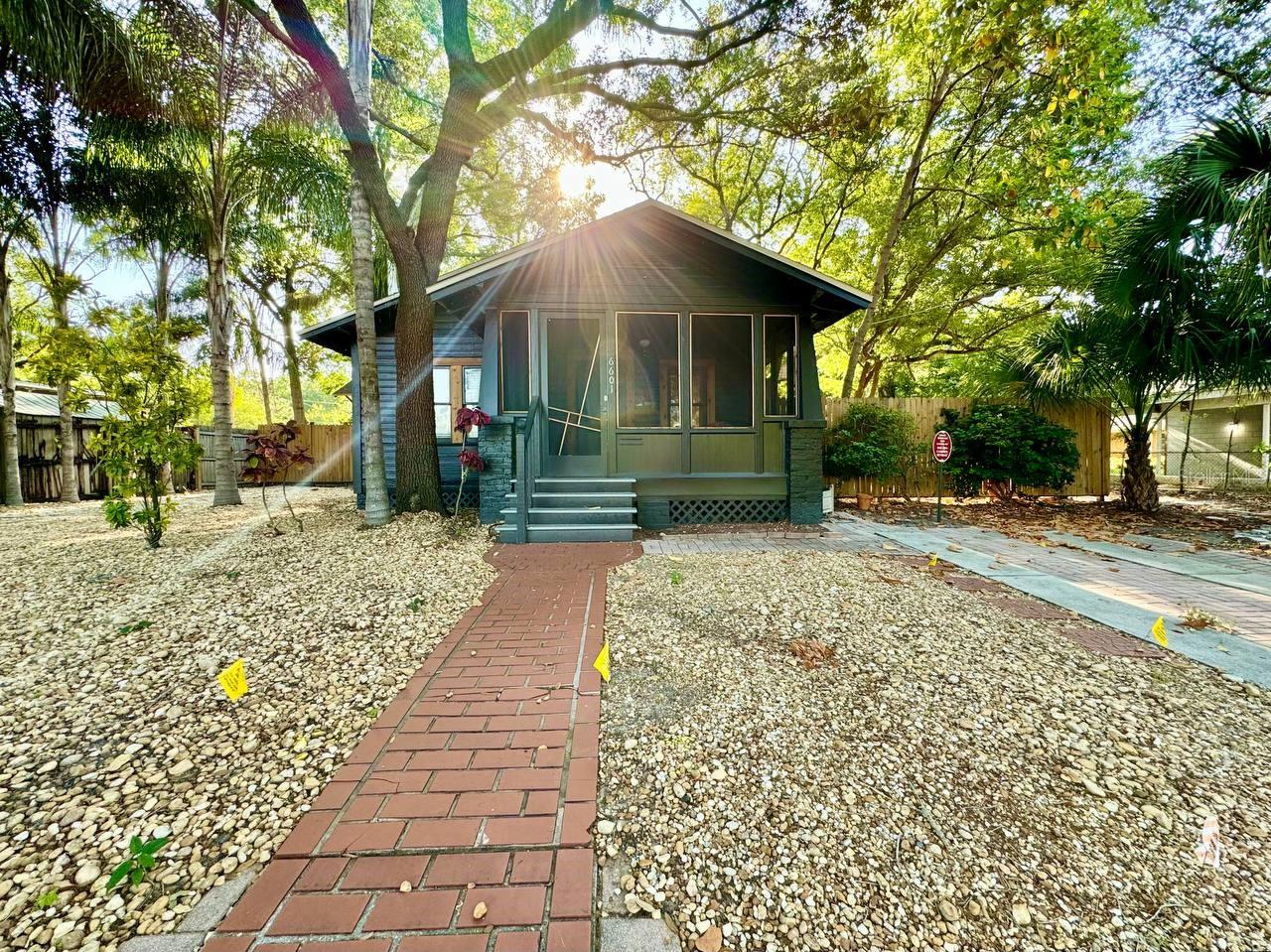 Welcome to this charming 2-bedroom, 2-bathroom home nestled in the heart of vibrant Seminole Heights. From the moment you step inside, you'll be captivated by the warmth and character of original hardwood floors that bring timeless appeal to the living space. A cozy library nook offers the perfect place to curl up with a good book or simply enjoy a quiet moment to yourself. Enjoy Florida's beautiful weather from either the screened-in front porch or the serene screened-in back porch ideal spots for morning coffee or winding down in the evening. Both bedrooms feature their own en suite bathrooms, offering privacy and comfort for residents and guests alike. Outside, a fenced backyard creates a private retreat for outdoor activities, gardening, or entertaining. You'll also enjoy the convenience of one designated parking spot in front of the home, along with additional street parking for guests. Lawn maintenance is included in the rental rate, making upkeep easy and stress-free. With an open floor plan, inviting spaces, and thoughtful amenities, this home captures the essence of relaxed Seminole Heights living. Don't miss your chance to experience it schedule your showing today! In addition to the advertised base rent, all residents are enrolled in the Resident Benefits Package (RBP) for $50.00/month which includes HVAC air filter delivery, credit building to help boost your credit score with timely rent payments, utility concierge service making utility connection a breeze during your move-in, and much more! More details upon application. The bed and desk in the second bedroom are affixed to the wall and can't be removed. Pets welcome! Occupied and Available 09/19/2025!