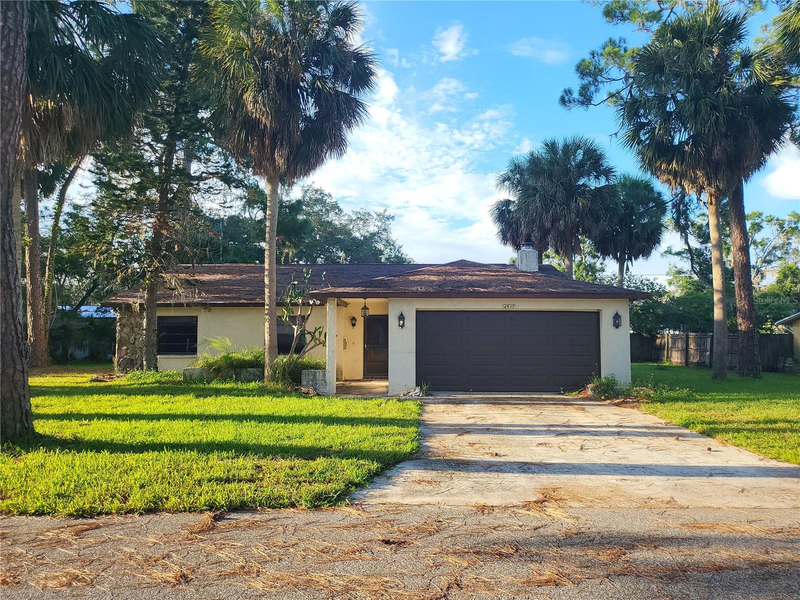 Gorgeous 3 Bed 2 Bath Home nestled on a lush quarter acre lot on a quiet culdesac street in the heart of New Port Richey. This beautiful home is a special fixer-upper opportunity since much of the inside has been removed due to flood damage remediation. It's a perfect blank canvas to renovate the interior. Check out the Matterport 3-D Virtual Reality tour attached. Nice large yard, stone fireplace and stone exterior accents, 2 car garage with side entrance door, vaulted ceilings and no HOA! Great location: Walking distance or bike ride to nearby playground, beach park or Historic Downtown New Port Richey. Buy it today before someone else does!