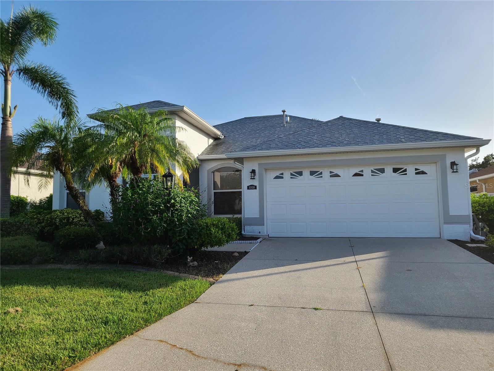 WELL-MAINTAINED 3-bedroom 2 bath HOME IN A GREAT NEIGHBORHOOD - MOVE-IN READY! Beautiful home has an OPEN SPLIT FLOORPLAN! Pristine home has luxury vinyl plank flooring throughout the living area and bedrooms. NO CARPET. Primary Bedroom is spacious with access to the lanai, his and her closets, and lots of natural light. The Primary bath has a walk-in shower and a large garden tub with Jacuzzi Jets. The other two bedrooms share a guest bathroom on the other side of the home providing privacy for all. Oversize screened-in lanai. Partially fenced in backyard. Kitchen overlooks family room. Indoor laundry room comes with the washer and dryer and a double pantry - conveniently located directly adjacent to the kitchen. Separate dining and living room. Community is surrounded by the Links at Greenfield Plantation golf course. Elementary and middle SCHOOLS are on the edge of this community. Pets okay with owner approval and nonrefundable pet fee. Lawncare is included in rent. Just two miles east of I-75. Move in ready!