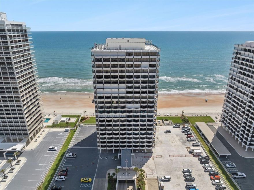 Located in a premier oceanfront community in Daytona Beach, this beautifully remodeled 11th-floor condo offers breathtaking panoramic ocean views and over 70 feet of wraparound balcony space to enjoy stunning sunrises and coastal breezes. Just steps from Ormond Beach with a desirable Daytona Beach address, this move-in-ready unit features tasteful updates throughout and a rare in-unit washer and dryer hookup. Residents enjoy resort-style amenities including a heated oceanfront pool, fitness center, BBQ area, updated common spaces, and a beautifully maintained beachfront setting. The building recently passed its engineering inspection and was found to be in excellent condition. Enjoy nearby beaches, dining, shopping, golf, NASCAR events, and Bike Week. Minimum rental period is 3 months.