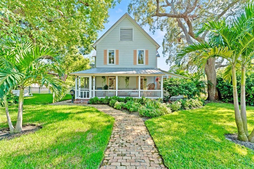 HISTORIC VICTORIAN FARMHOUSE, DOUBLE LOT, LARGE SALTWATER POOL, DOWNTOWN YET PRIVATE, DUAL AC UNITS, GREAT ROOM KITCHEN, TANKLESS WATER HEATER, ZONING ALLOWS 3 RESIDENTIAL UNITS! THIS VICTORIAN FARMHOUSE IN DOWNTOWN ON A DOUBLE LOT WITH A SALT WATER POOL IS YOUR PERFECT DOWNTOWN DUNEDIN HOME! Imagine waking up every day in a home that feels like a storybook come to life. Built in 1900 and beautifully maintained, this iconic VICTORIAN FARMHOUSE sits proudly on a rare DOUBLE LOT, totaling a half-acre on one of the most beloved streets in Historic Downtown Dunedin. The home is set back from the sidewalk, giving it a stately presence and a quiet, private feel. The red brick walkway leads past a front yard shaded by beautiful mature trees complete with a classic tree swing.The wraparound screened porch feels like a step back in time, where mornings start with coffee and evenings end with the warm glow of lantern light and conversation. Inside, this home exudes character with pristine original wood flooring, beadboard walls, and antique door knobs which blend seamlessly with modern updates. Three solar tubes fill the interior with abundant natural light, giving the home a warm and airy feel. With 4 bedrooms plus an office (or 5th bedroom), 3 remodeled bathrooms, and a spacious laundry room, this home is as functional as it is enchanting. The great room style kitchen boasts a copper farmhouse sink, copper bar sink, quartz countertops, neutral cabinetry, pantry, natural gas stove, and new Cafe Refrigerator and Bosch dishwasher. Great for hosting large dinners — just open the French doors to let the party flow to the pool and lanai with built-in speakers throughout the first floor let you set the mood. The primary suite offers a peaceful retreat with a walk-in closet and a spa-like bath featuring a custom antique vanity, glass shower, and private water closet. Additional bedrooms are generous and light-filled, with a second bath offering dual pedestal sinks to match the home’s timeless aesthetic.This property has been thoughtfully updated with a newer dual-zone AC system with gas heat, upgraded electrical, hardwired smoke detectors, aluminum & Hardie board siding, and a brand new fence. Out back, the magic continues with a screened-in pool and covered lanai with red brick pavers, surrounded by an extremely private fenced yard. There’s also a large outdoor closet for storage. The detached oversized 2-car garage was built to support a second story, making it ideal for a future guest suite, art studio, or office. Space for boats, RVs, and golf carts. Zoned MF 7.5 allowing for 3 residential units & this property even allows for a conditional-use bed-and-breakfast. You’re right in the heart of everything — Tukro Coffee just around the corner and Downtown Dunedin’s parades, shops, restaurants, breweries, festivals, and the Pinellas Trail. This isn’t just a home — it’s an experience, a lifestyle, and a rare opportunity to own a piece of Dunedin’s history on one of the most special lots in town.