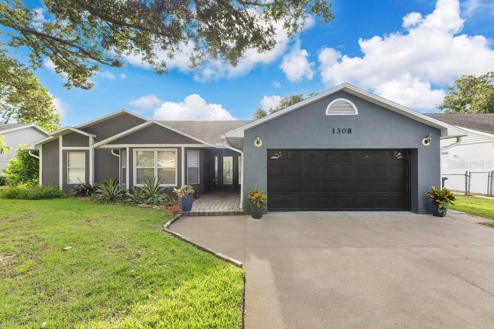 This property qualifies for a CREDIT UP TO $6750 through the seller's preferred lender ~ Welcome to this beautifully maintained 4BD/3BA single story POOL HOME in the established Canoe Creek Woods community of St Cloud! Major updates include: a RESURFACED POOL, UPDATED PLUMBING (2024), NEWER ROOF (2019), and an UPDATED A/C & WATER HEATER – you can move right in and start enjoying the Florida lifestyle. The heart of this home is the modern kitchen; showcasing a desirable color palette, sleek GRANITE COUNTERTOPS, an ISLAND with cooktop and range hood, generous cabinet and counter space, and a BUILT-IN DOUBLE SMART CONVECTION OVEN. The kitchen flows seamlessly into the light filled breakfast nook and OPEN LIVING AREA, perfect for everyday living or entertaining. A formal dining space is ideal for special occasions, while VAULTED CEILINGS add to the bright, air feel throughout. Your PRIMARY SUITE is privately positioned at the back of the home, offering tranquil WATER VIEWS, two sets of French doors for abundant natural light, direct access to the lanai and pool, a large WALK-IN CLOSET, and well appointed en-suite bath. The fourth bedroom also enjoys its own en-suite bath – ideal for guests or a home office. Bedrooms two and three are located at the front of the home off a separate hallway with the third full bath, creating a versatile layout for a variety of needs. LUXURY VINYL PLANK and TILE FLOORING run throughout the home, and modern touches like a SMART THERMOSTAT keep comfort and efficiency in mind. An added bonus is the ultimate private retreat - a dedicated BONUS ROOM/OFFICE/CRAFT SPACE accessed from the exterior, complete with built-in cabinetry for storage. Outside, your backyard oasis awaits featuring a sparkling OPEN AIR POOL, covered LANAI, and FENCED YARD – all with NO REAR NEIGHBORS and peaceful POND VIEWS! Lovely mature trees add character and shade to the property. The LOW HOA adds even more appeal, along with an unbeatable location close to shopping, dining, recreation, and lakes, with easy access to the Florida Turnpike. Well maintained, thoughtfully updated and in a prime St Cloud location – Wood Lake Circle is ready to welcome you HOME!